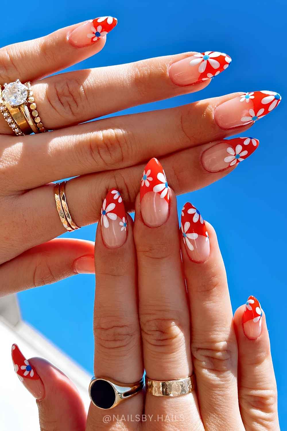 Red French mani with white and blue flowers