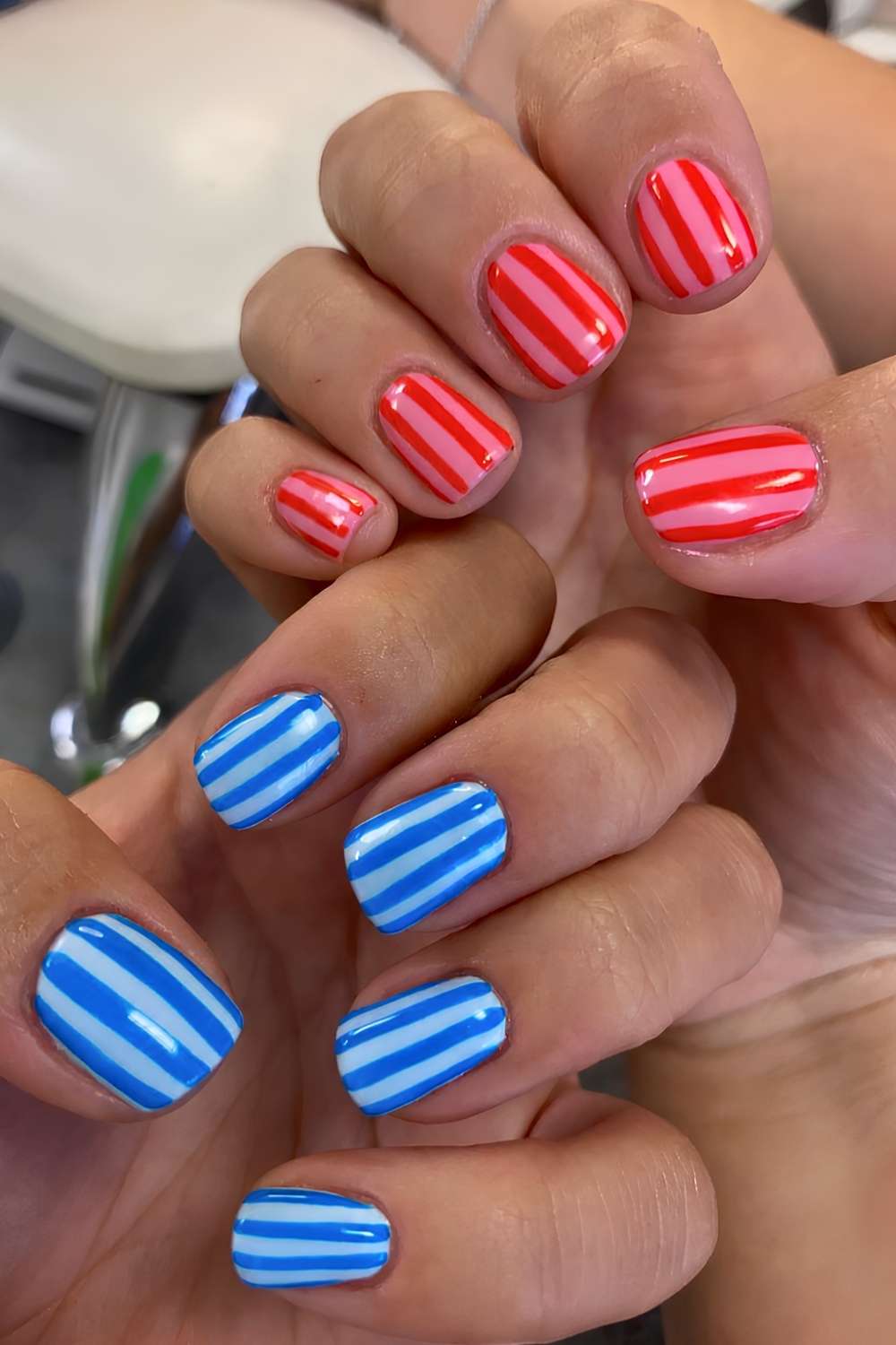 Red and blue striped manicure