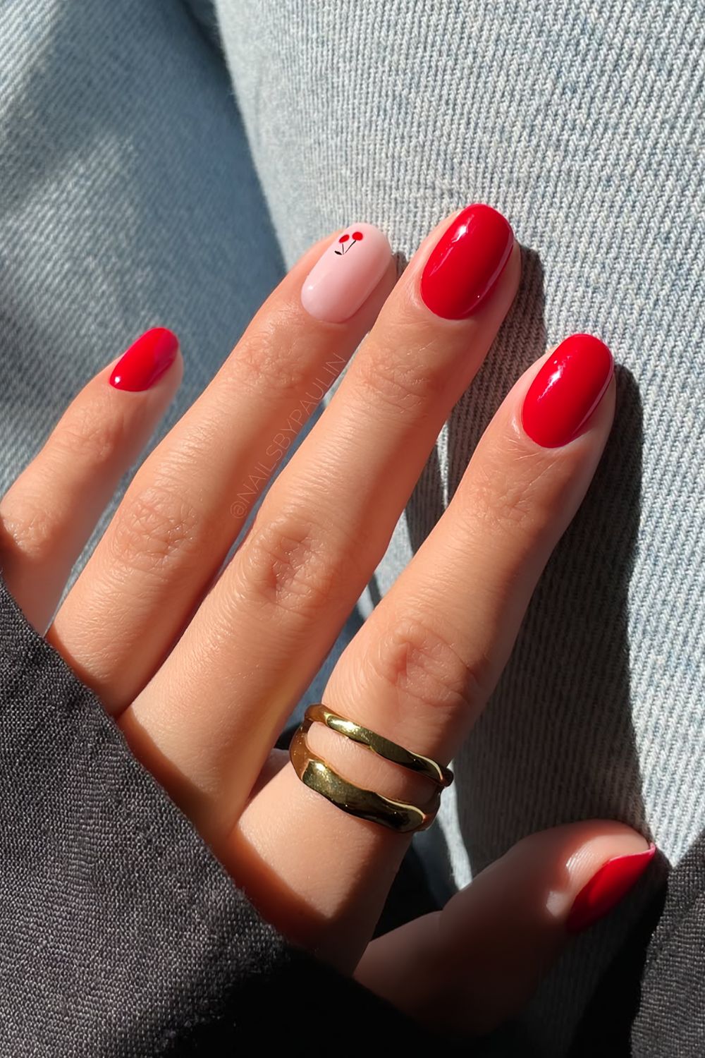 Red short nails with cherry accent