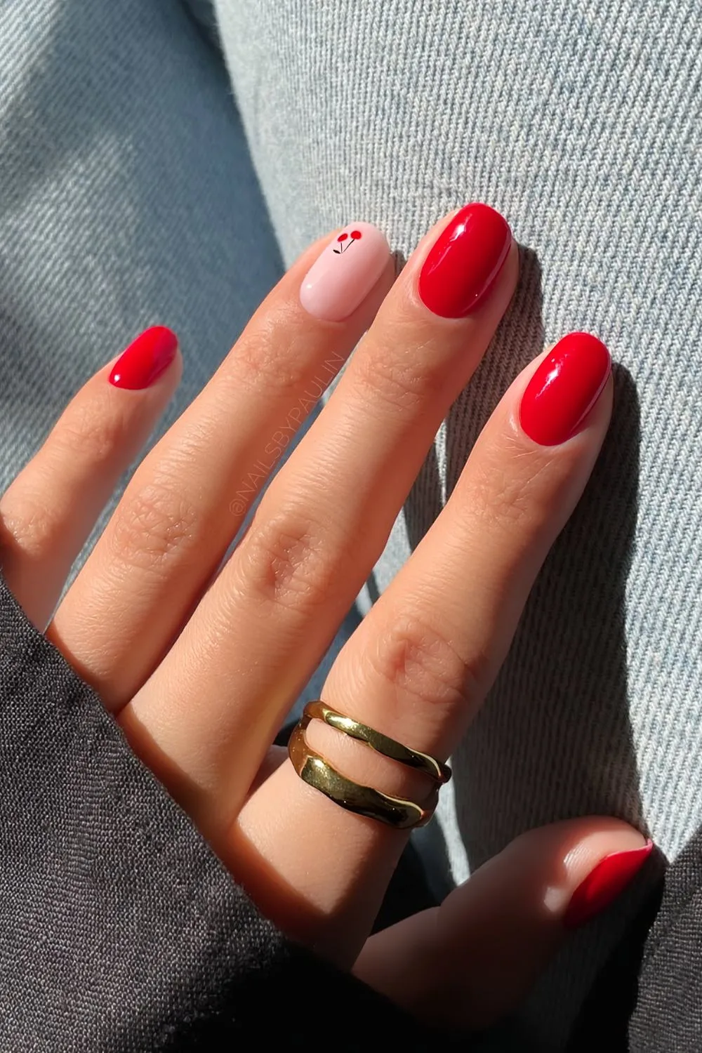 Red short nails with cherry accent