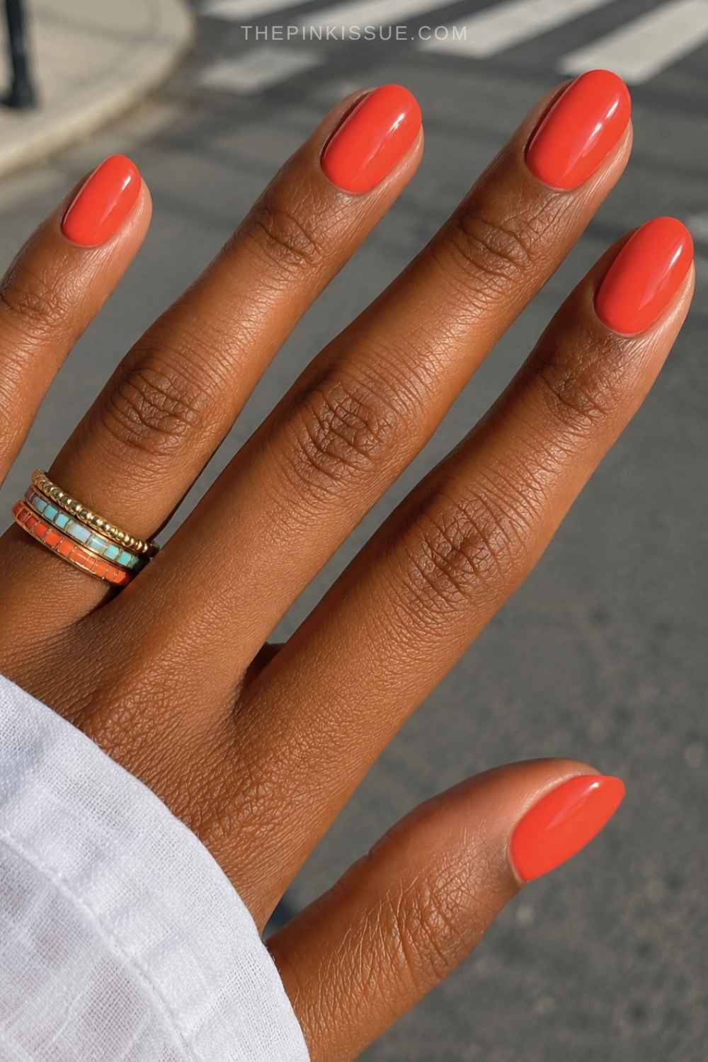 Round deep orange nail design