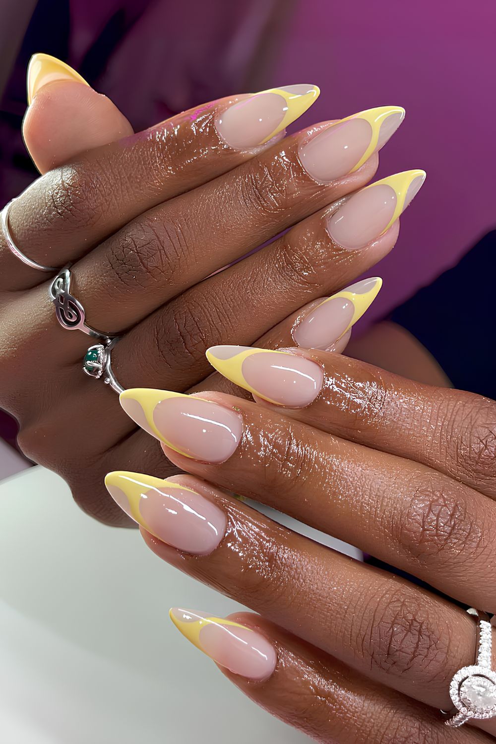 Swirly yellow French tip manicure