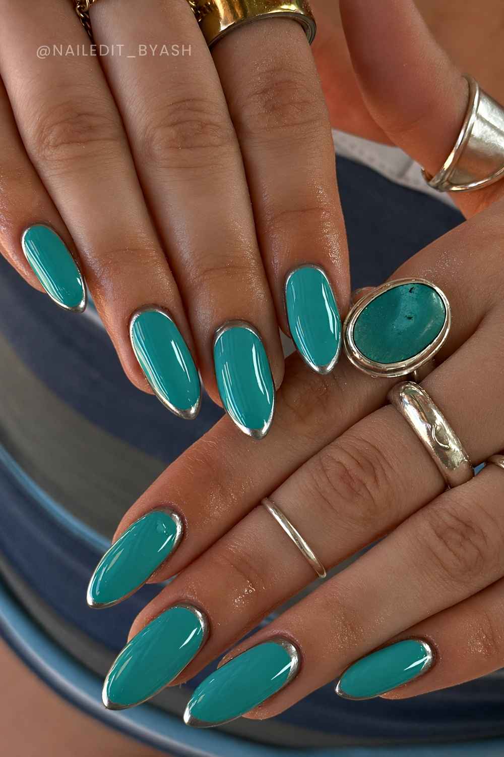 Teal nails with silver halo art