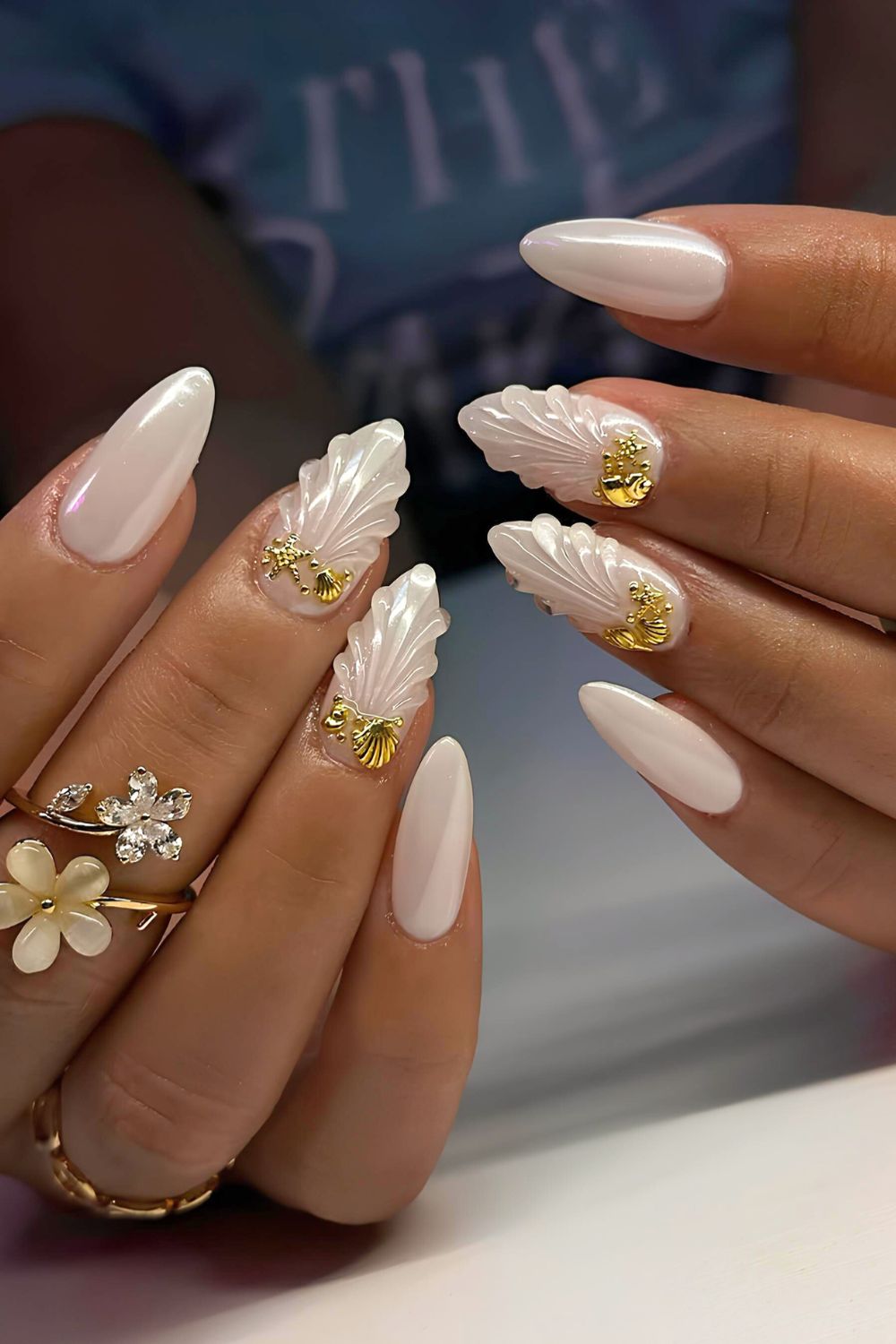 White chrome mani with textured detailes and gold accents