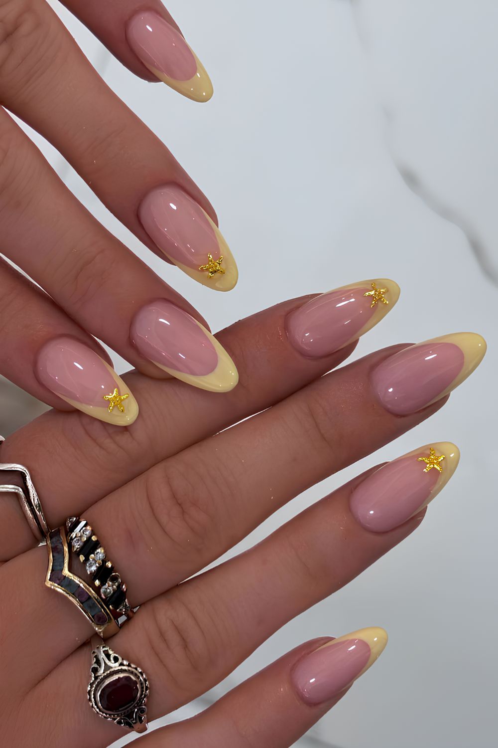 Yellow French mani with gold starfish accents