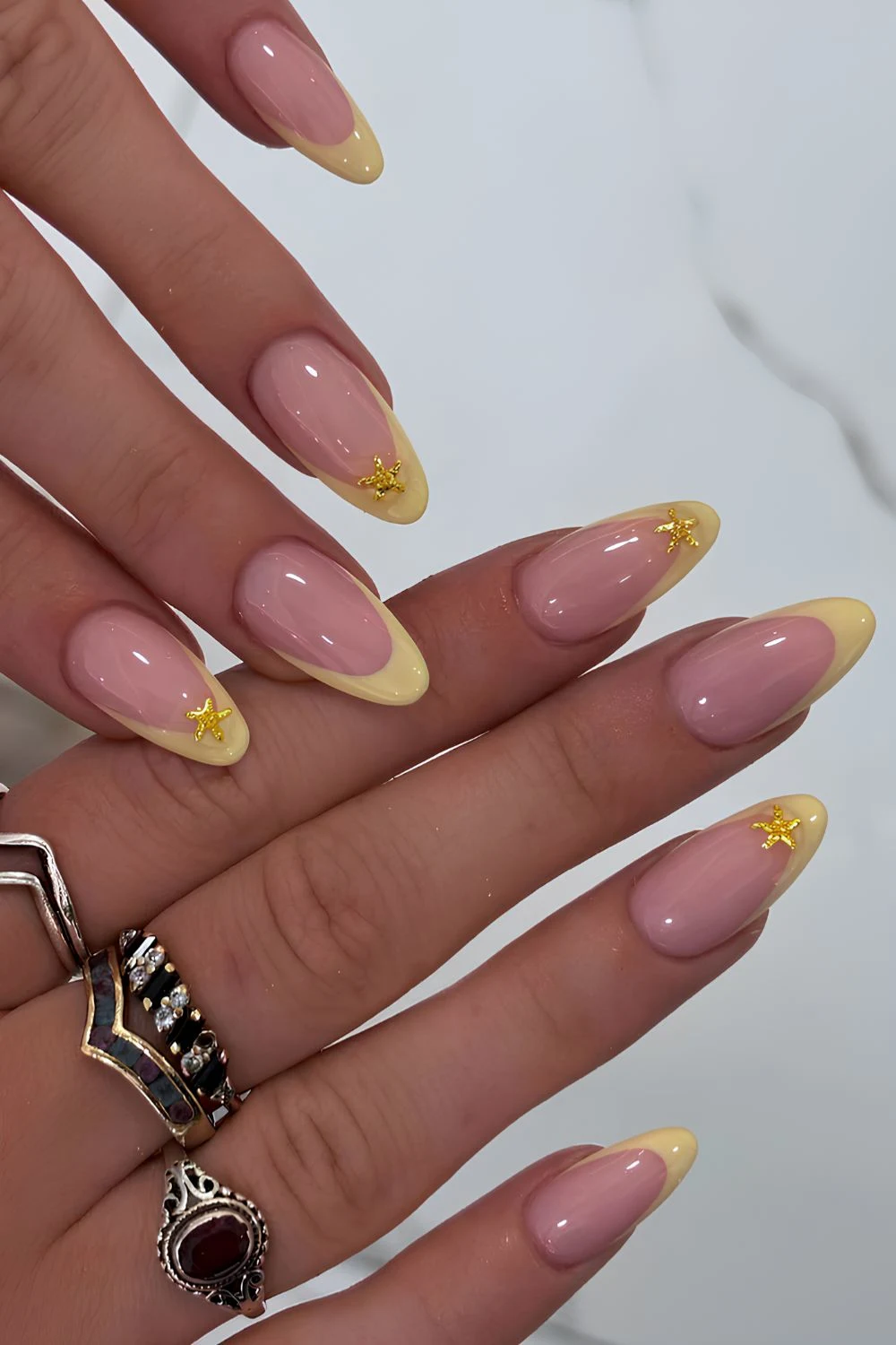 Yellow French mani with gold starfish accents
