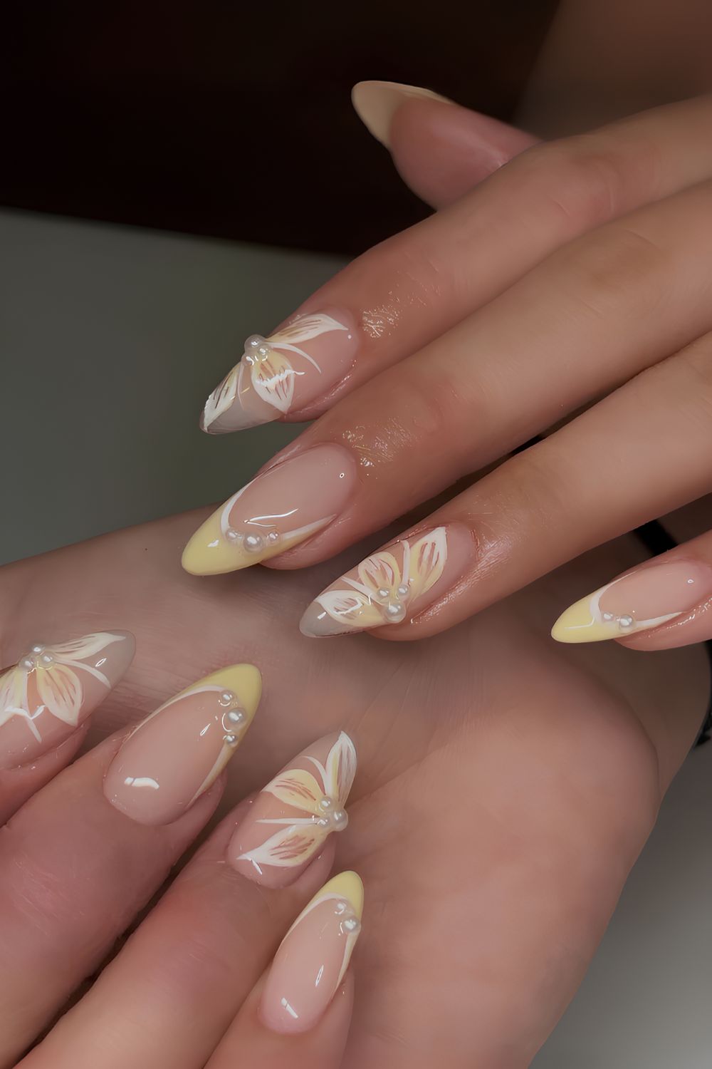 Yellow French mani with pearls and flowers