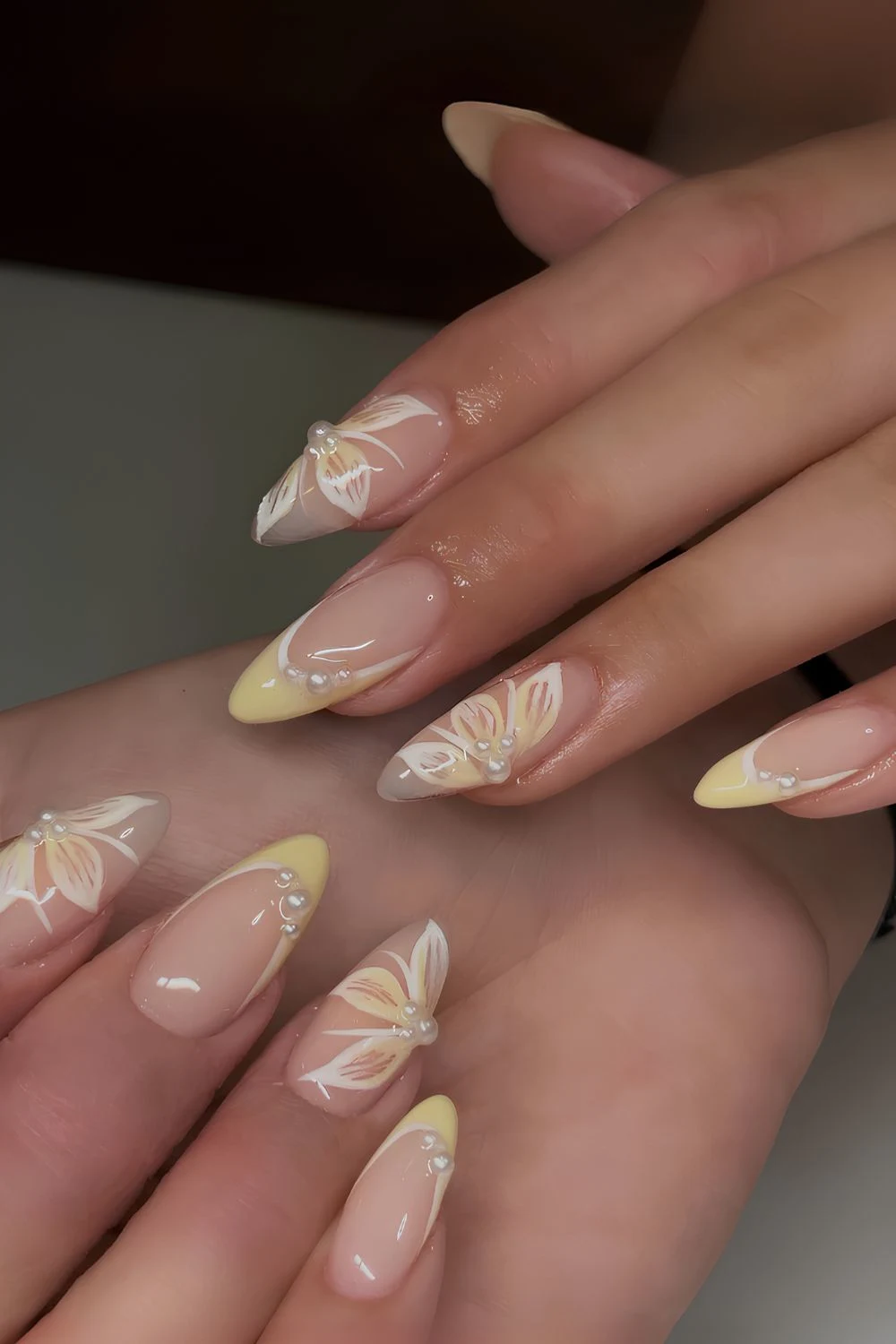 Yellow French mani with pearls and flowers