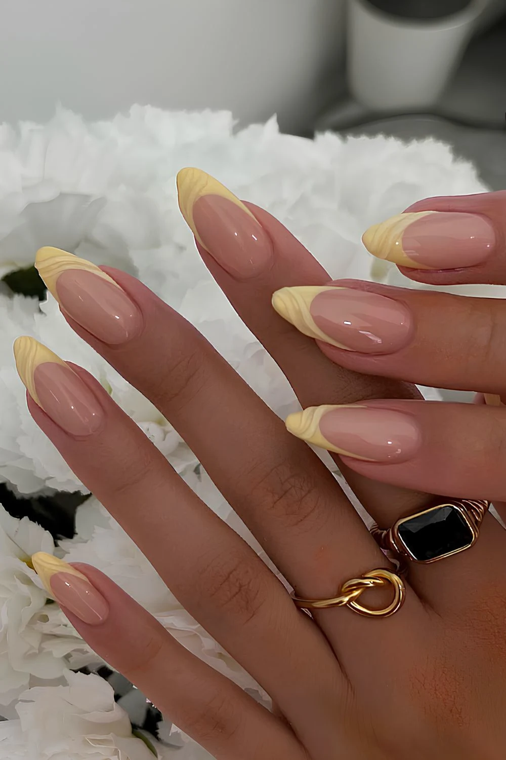 Yellow French mani with textured swirls