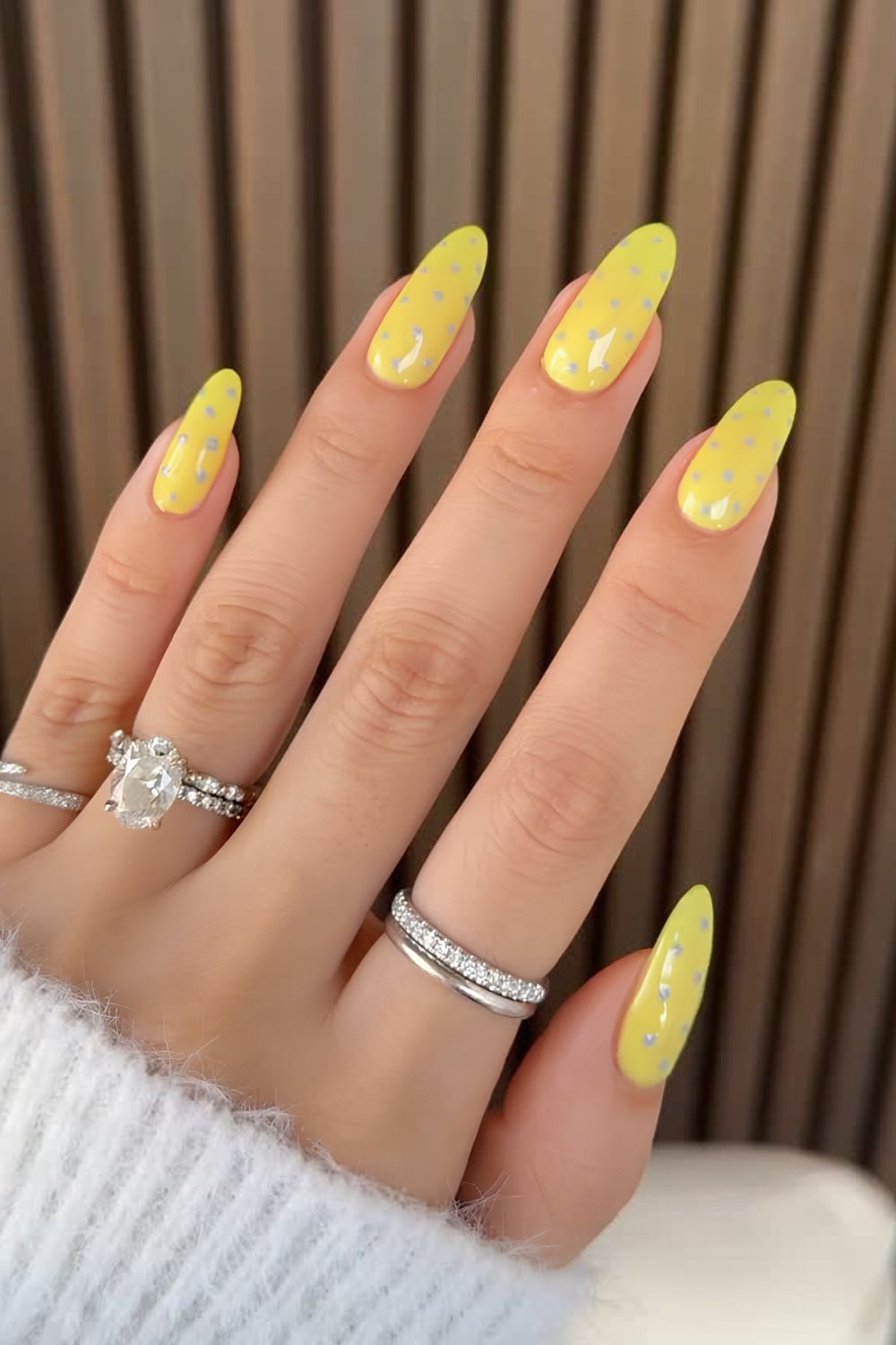yellow nails with gray polka dots