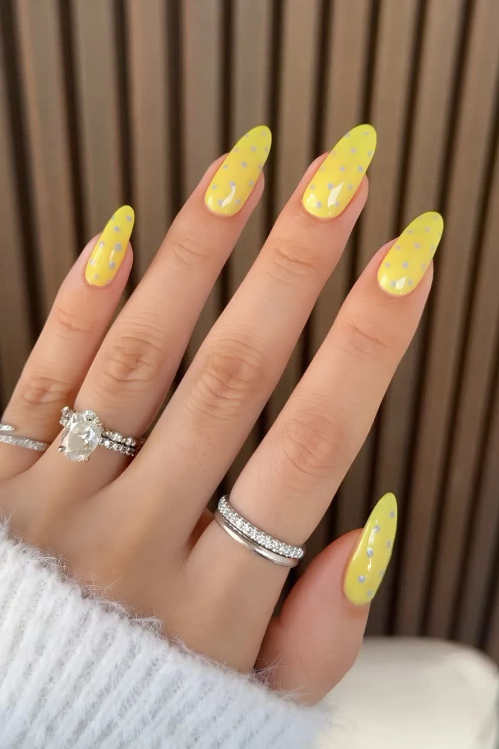 yellow nails with gray polka dots