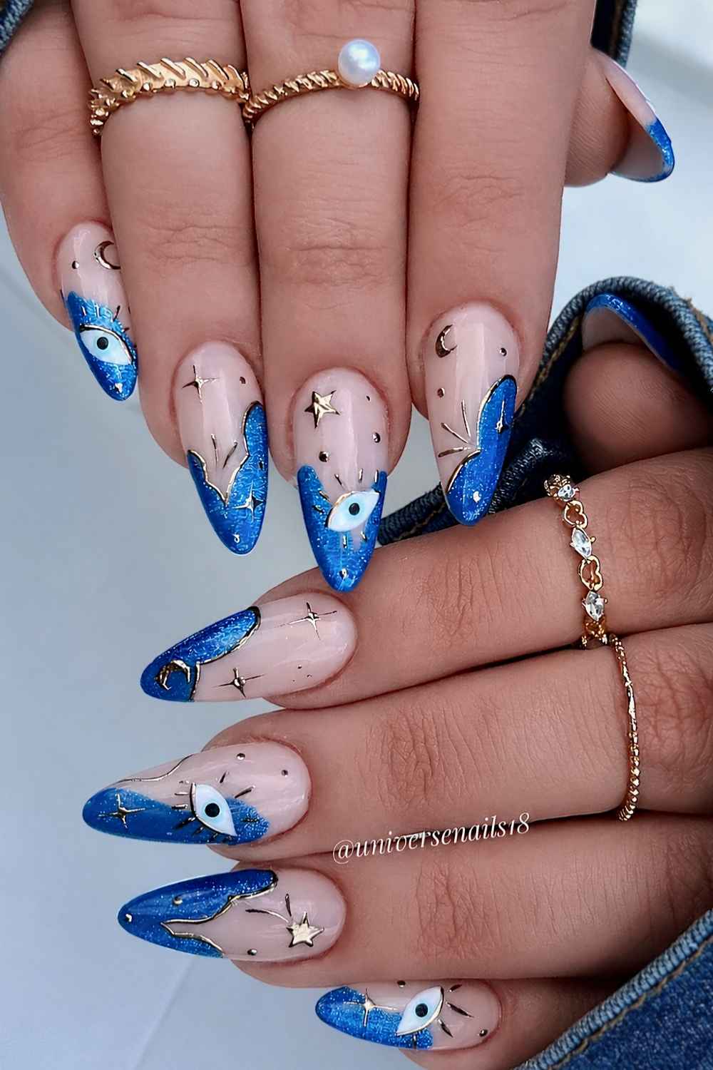 Abstract blue French nails with evil eye art