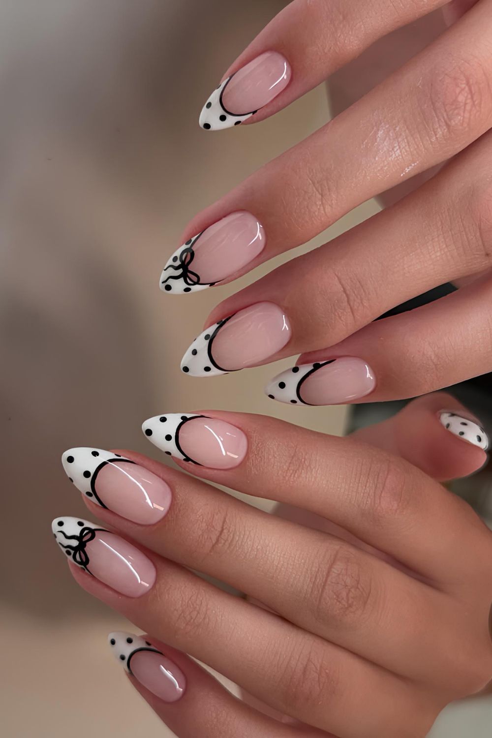 Black and white French mani with polka dots and bows