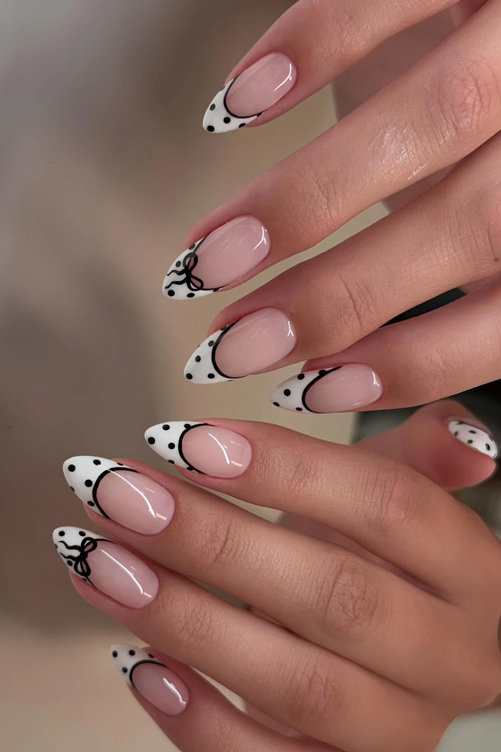 Black and white French mani with polka dots and bows