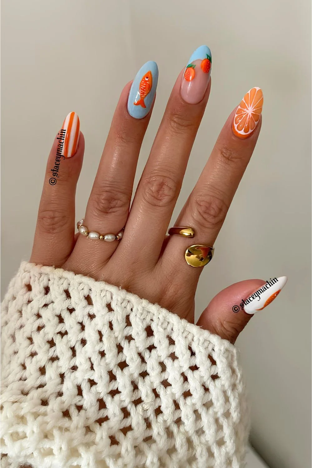 Blue and orange mani with stripes, orange and fish accents