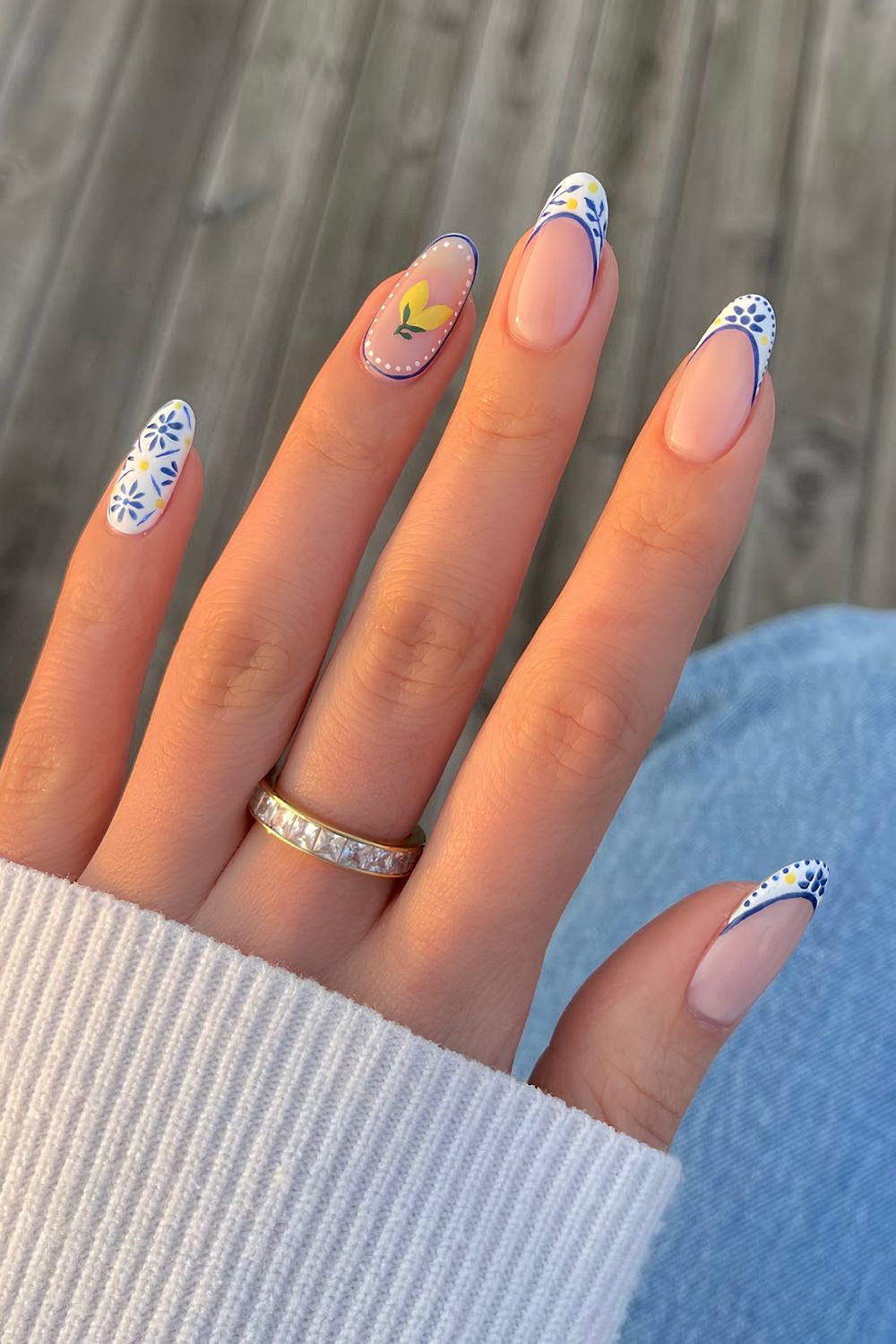 Blue and white French tip nails with lemon accents