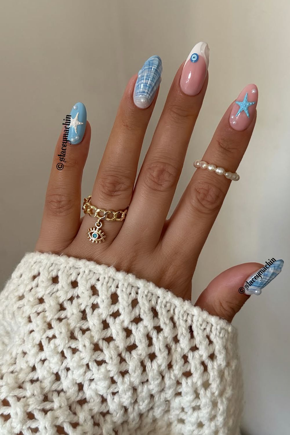 Blue and white ocean nails wit evil eye motiv