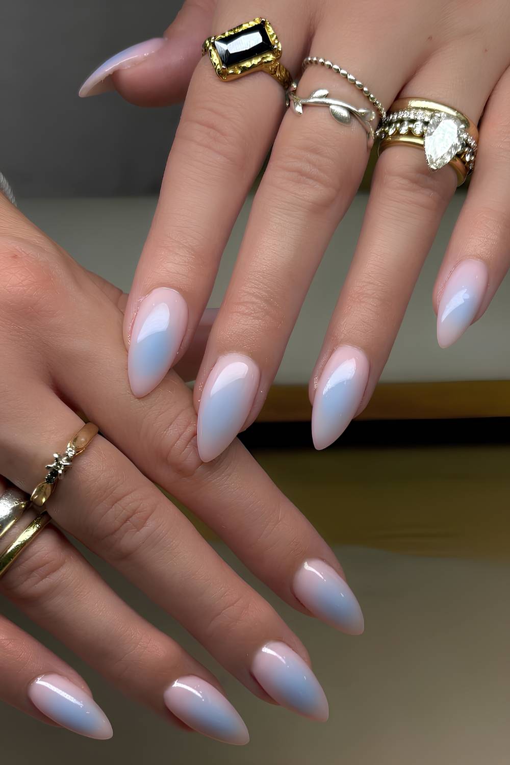 Blue aura nails on a milky pink base