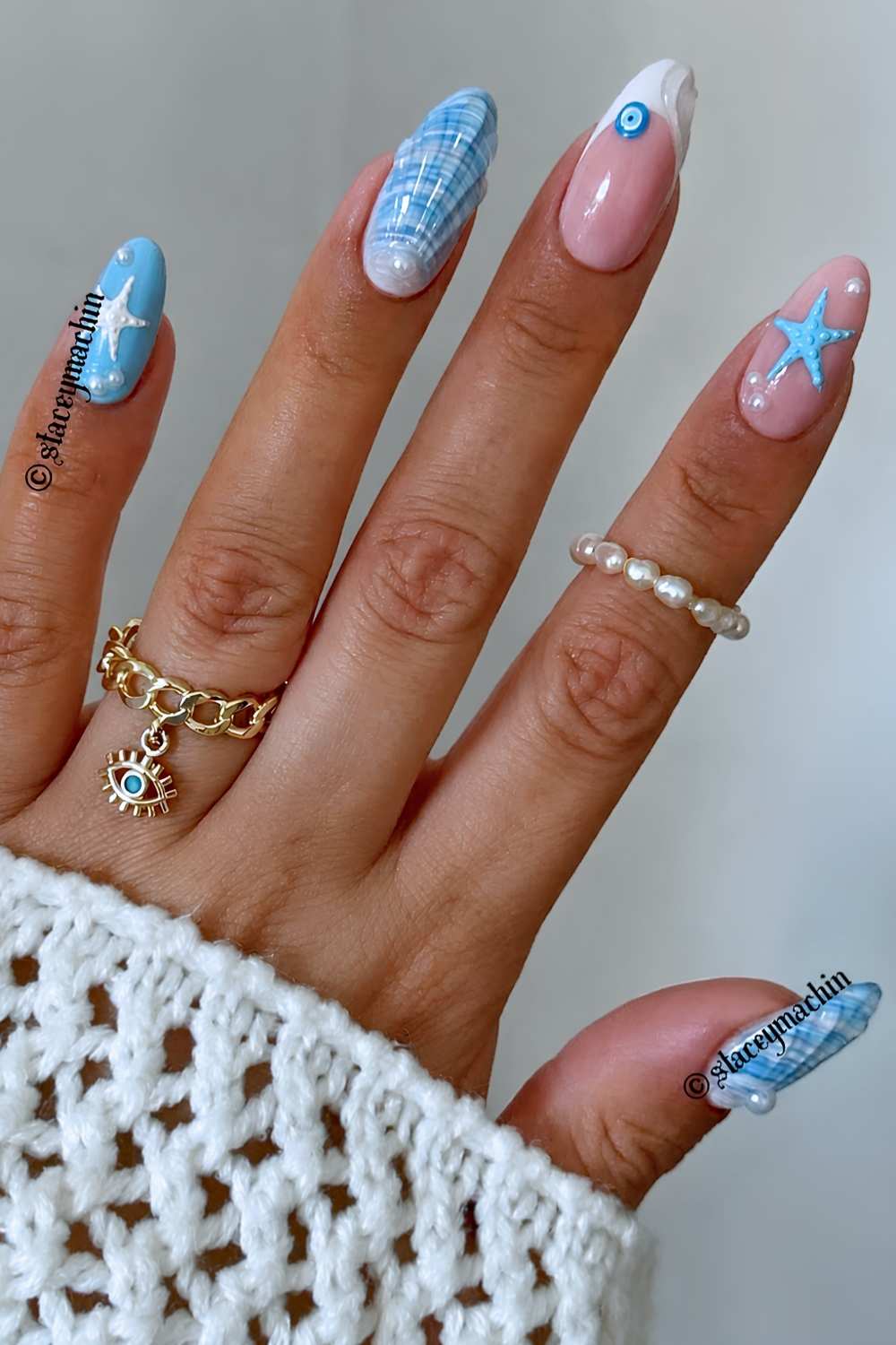 Blue nails with seashell and nazar art