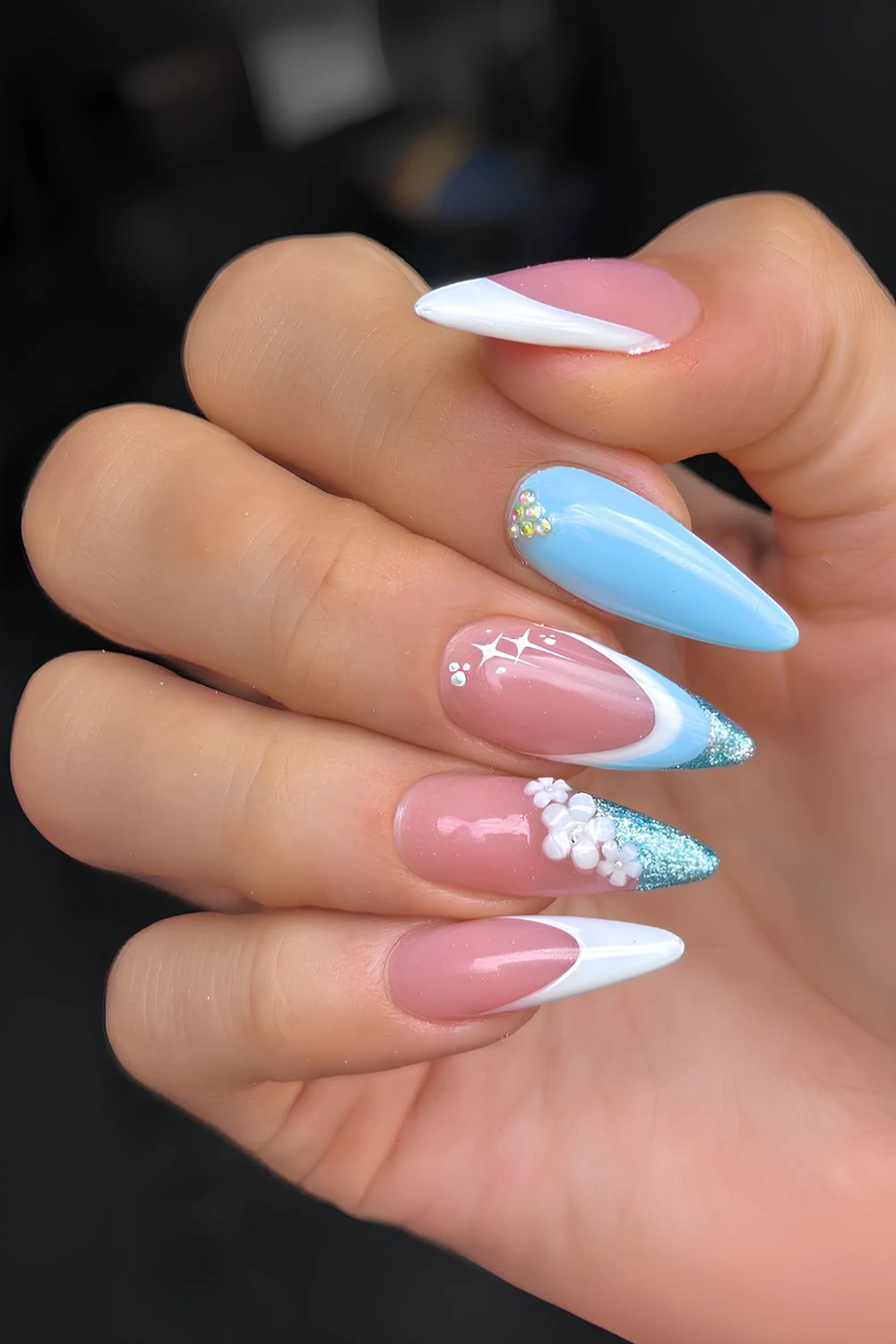 Blue nails with textured flowers and glitter