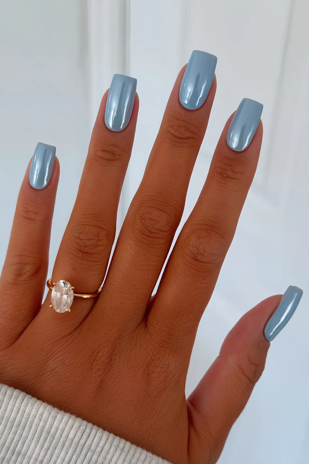 Blue pearl chrome manicure