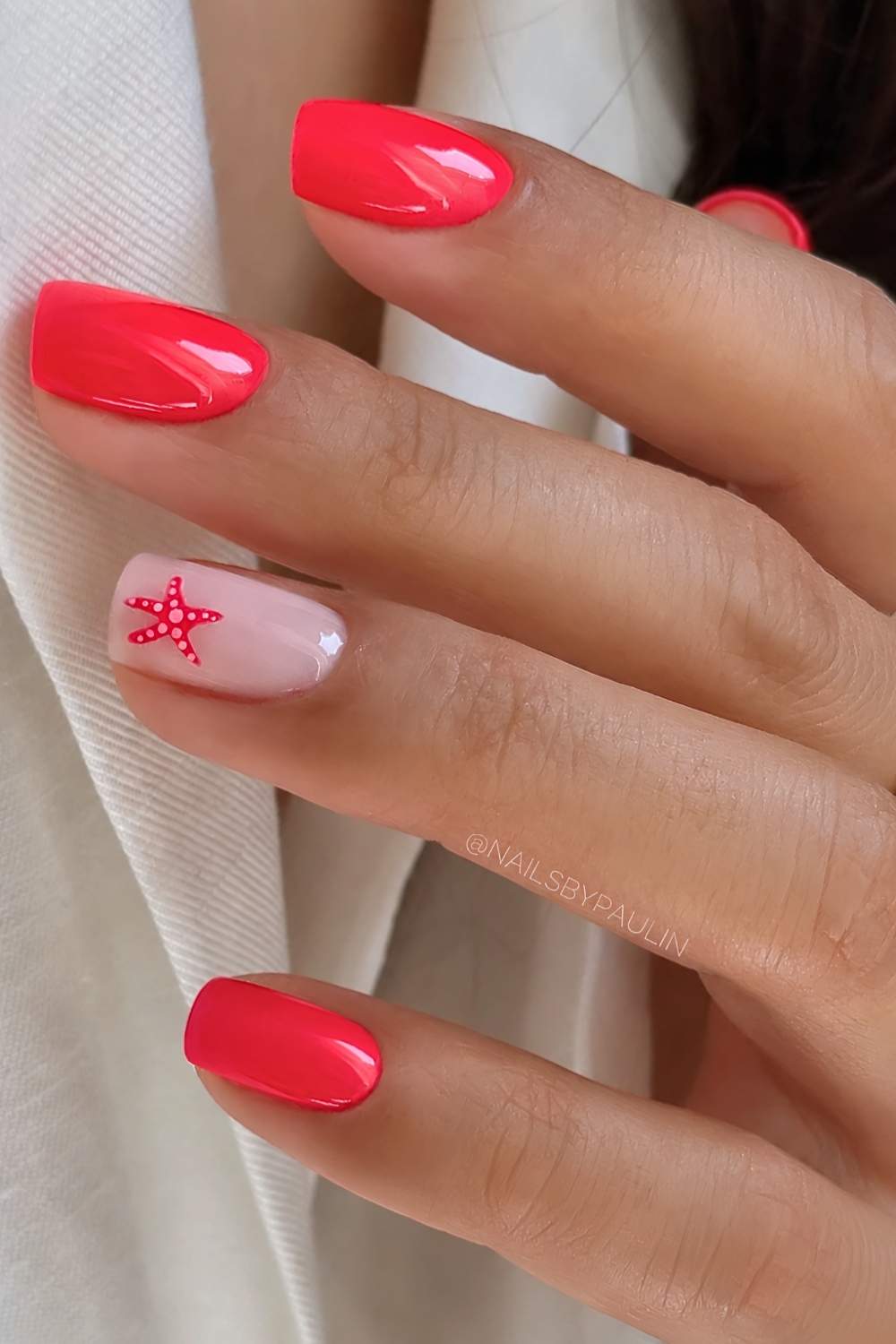 Bright red nails with accent starfish