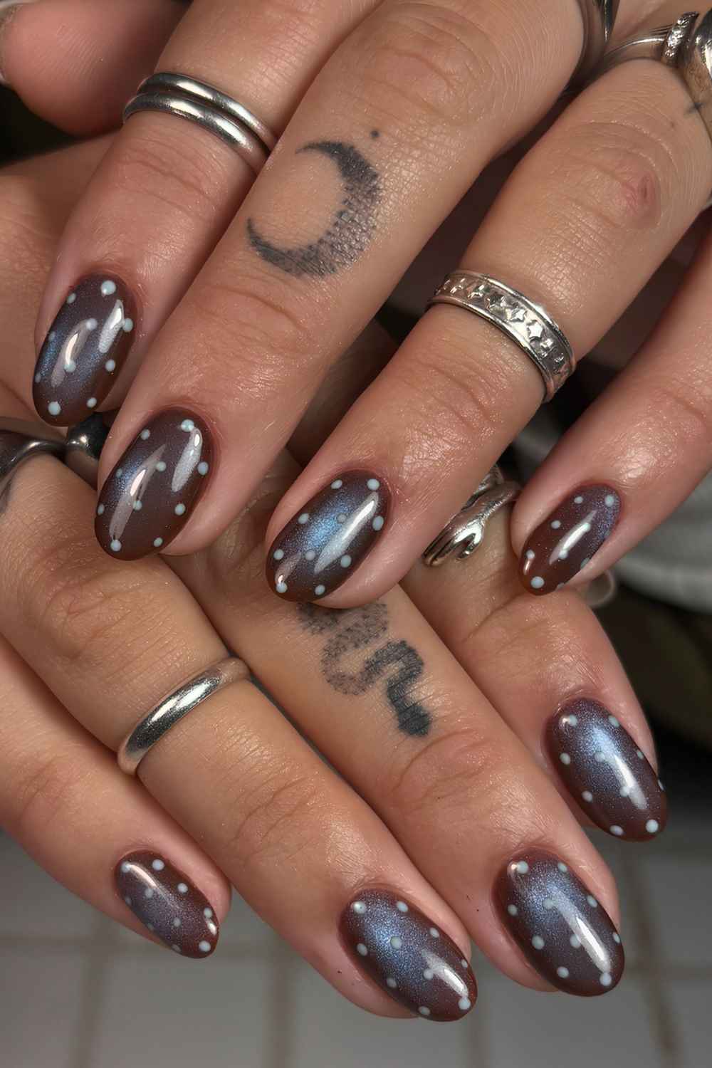 Brown and blue cat eye nails with polka dots