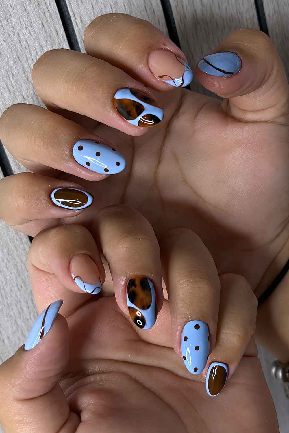 Brown and blue nails with dots and tortie shell