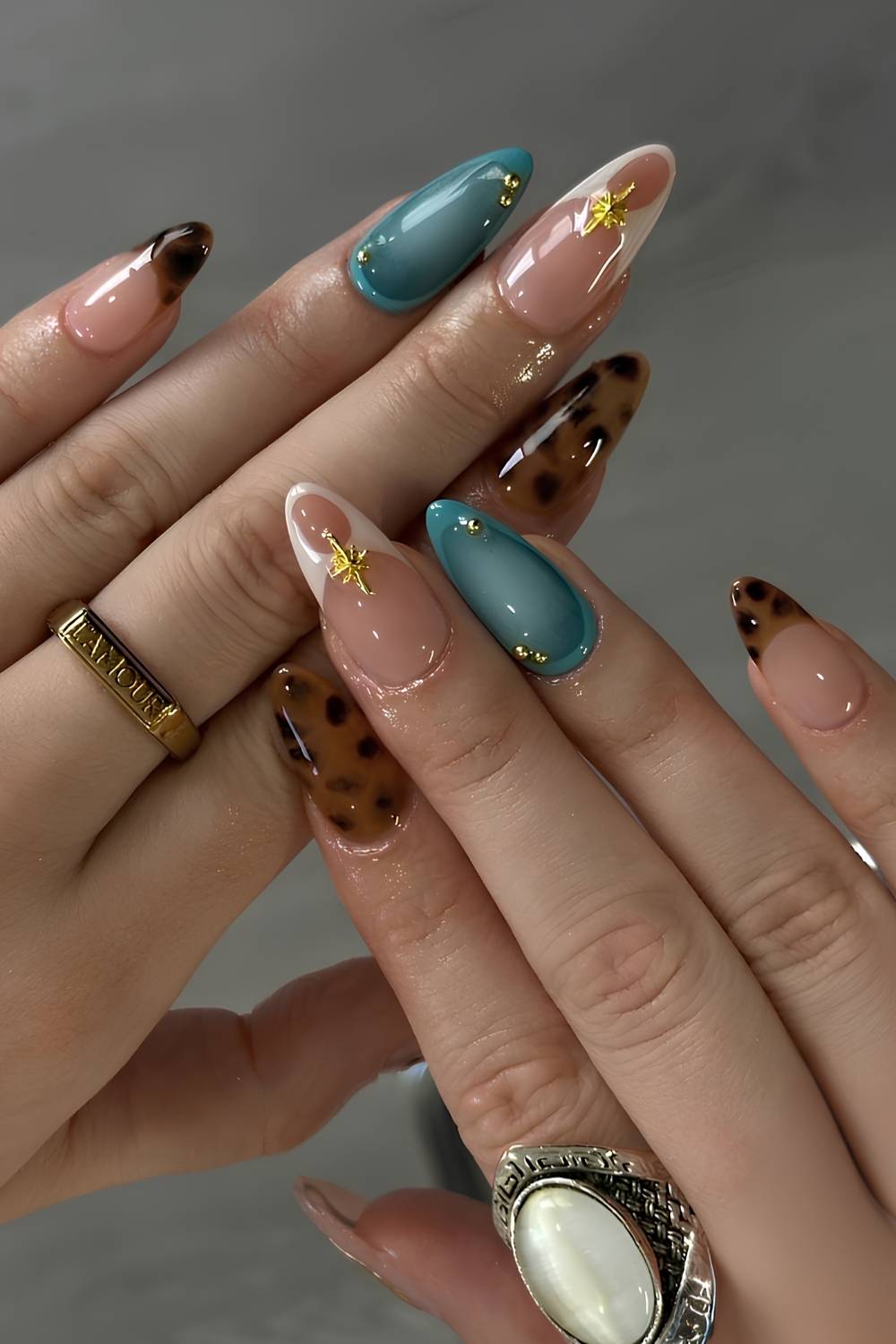 Brown and blue nails with tortie shell and gold accents