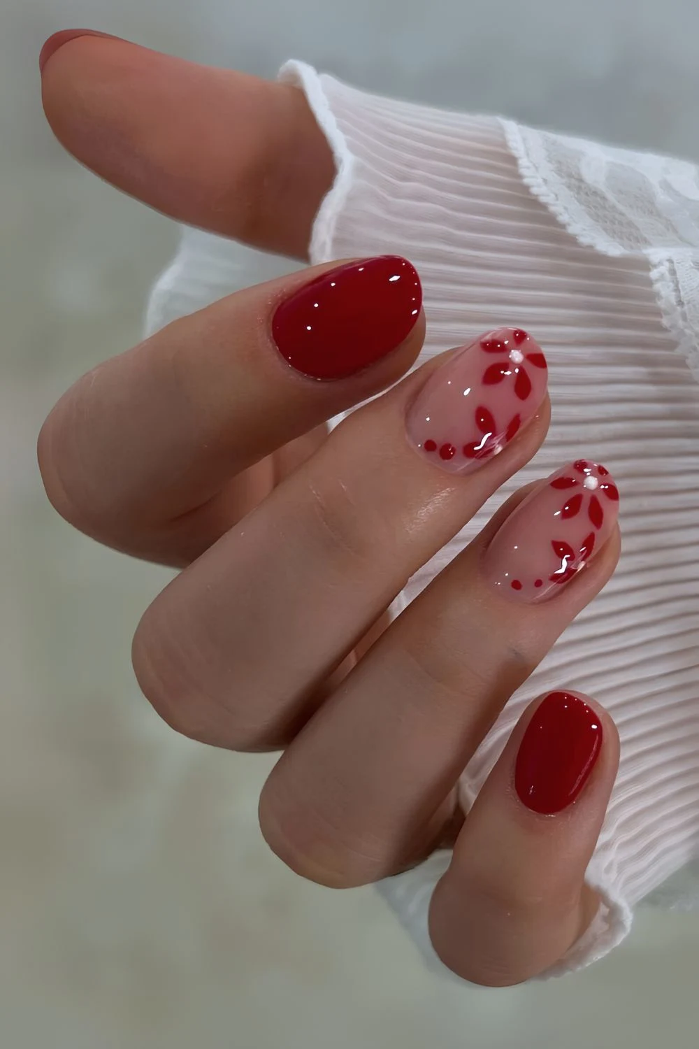 Cherry red nails with floral art