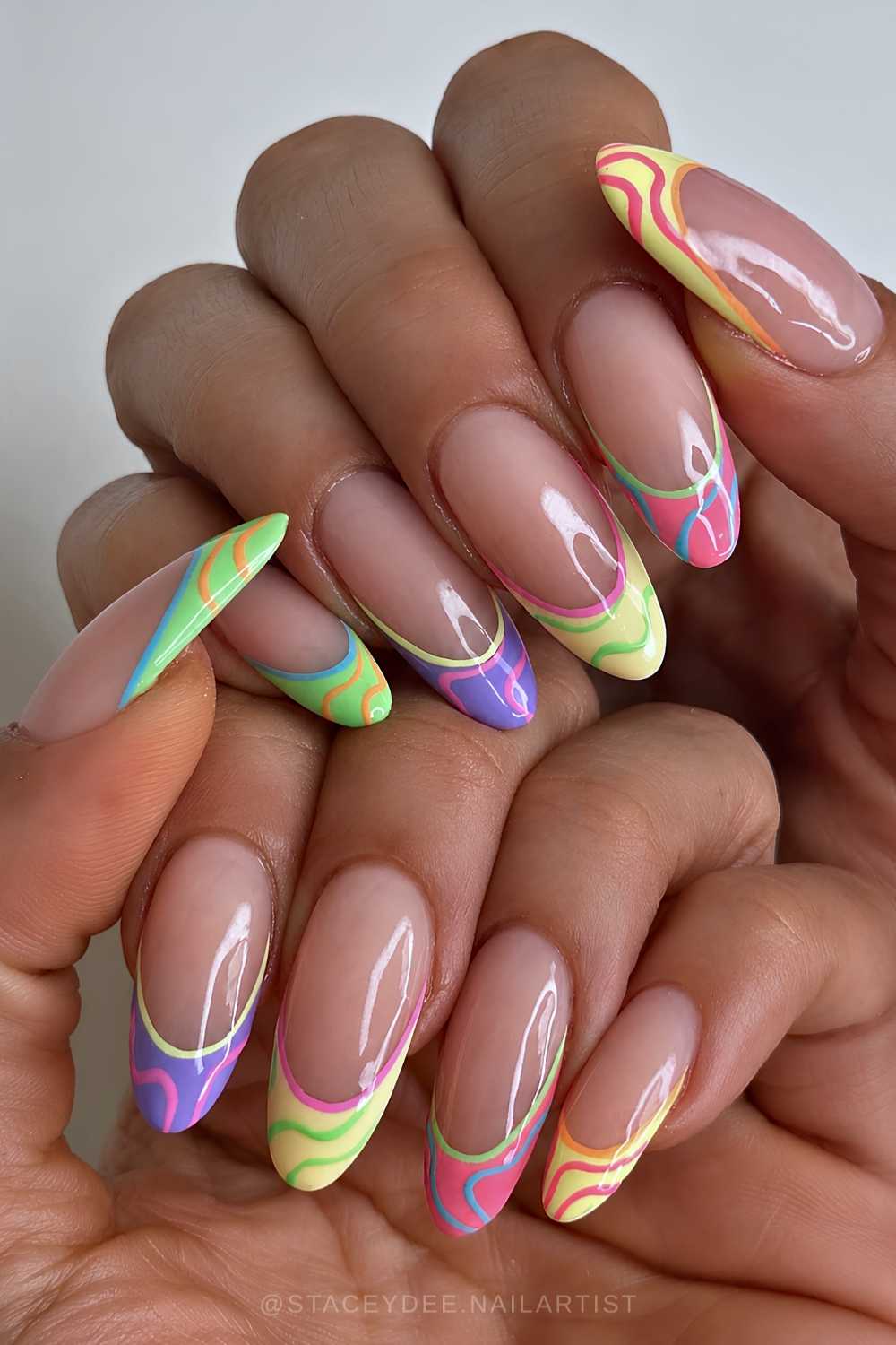 Colorful French nails with funky swirls