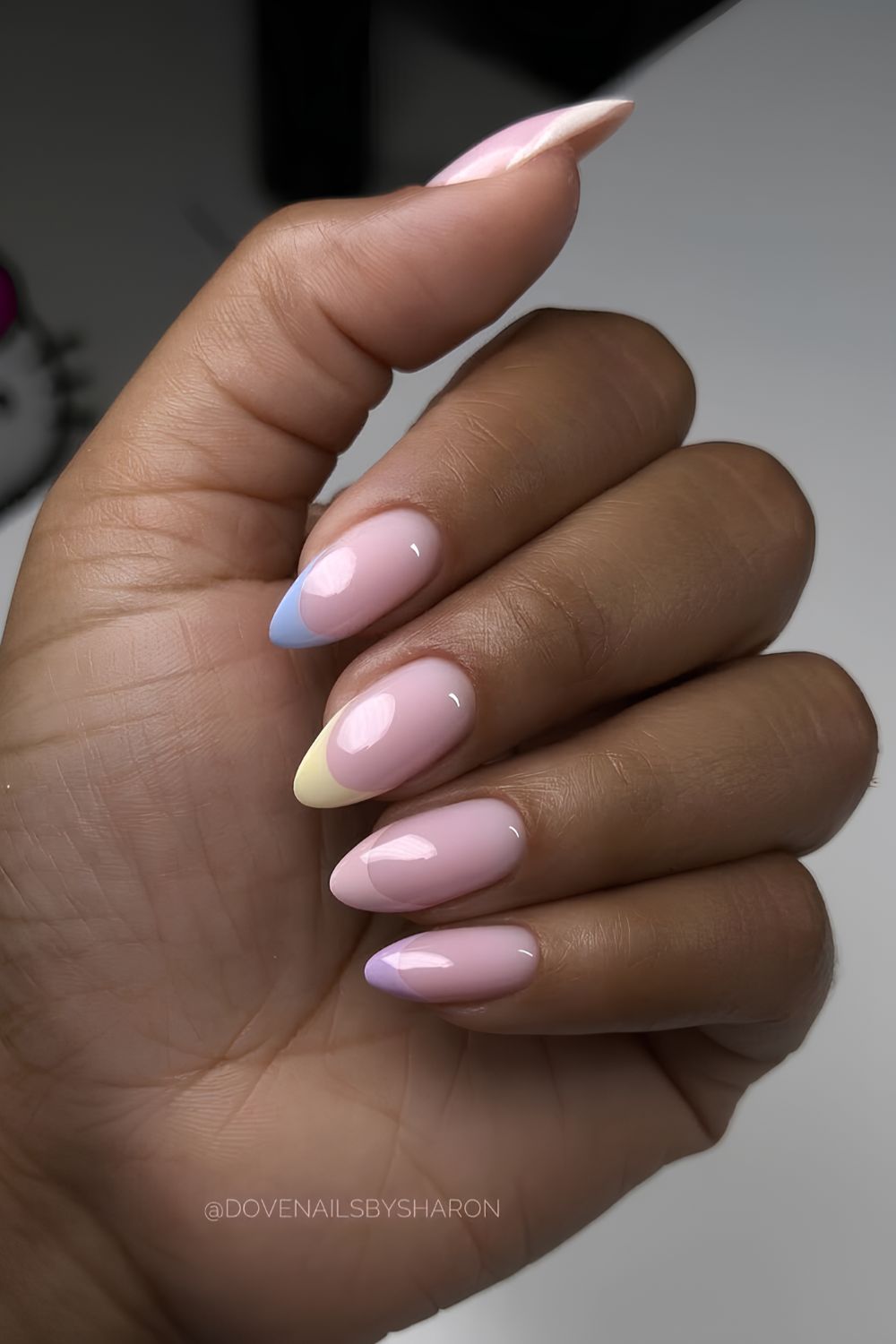 Colorful pastel French mani on a milky base