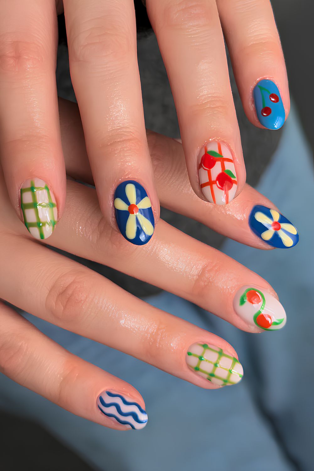 Colorful picnic inspired nails with gingham and fruit art