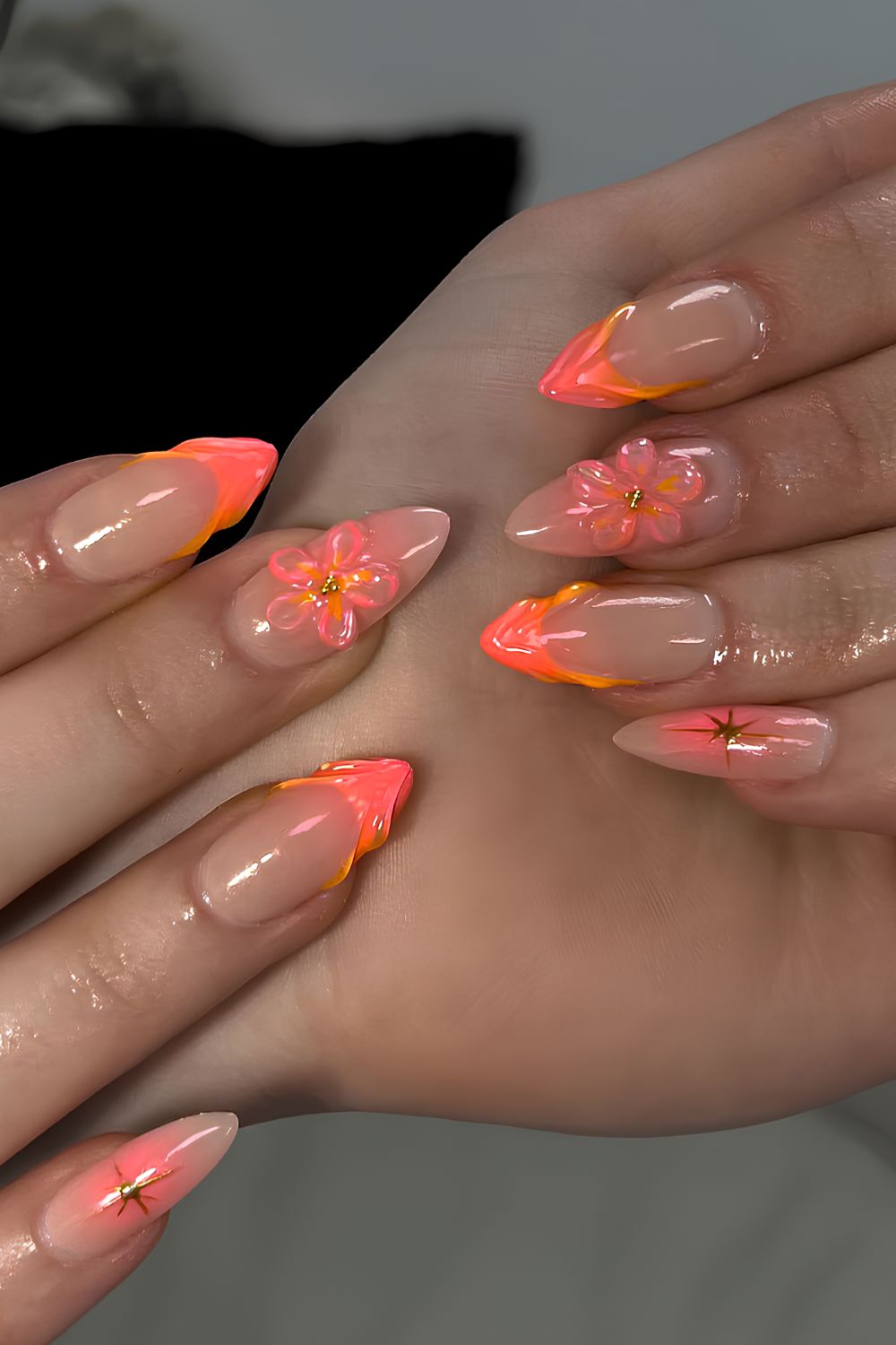 Coral French nails with textured flowers