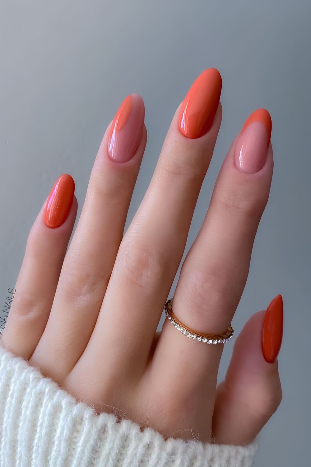 Coral orange nails with negative space accents