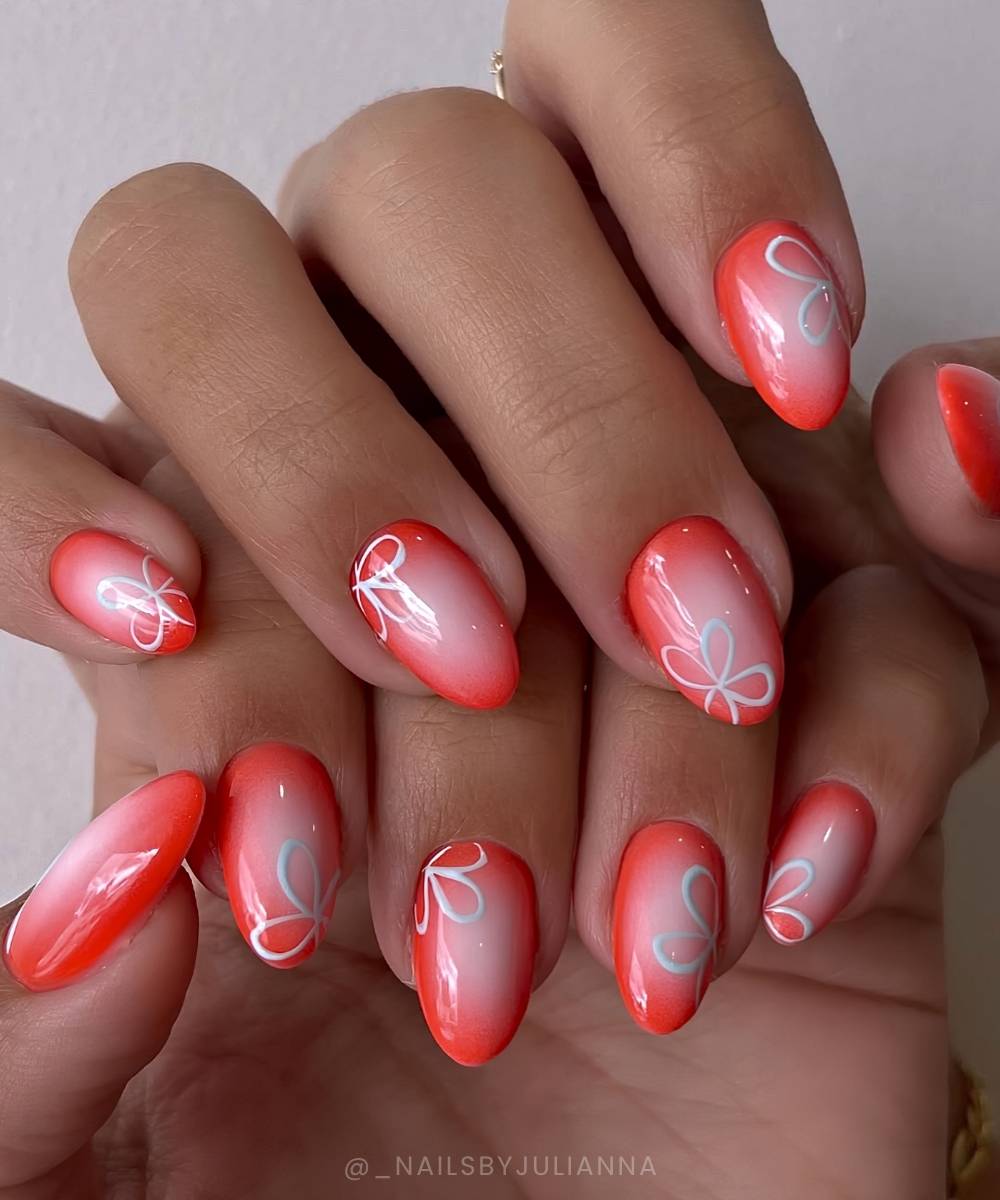 Coral red nails with floral art