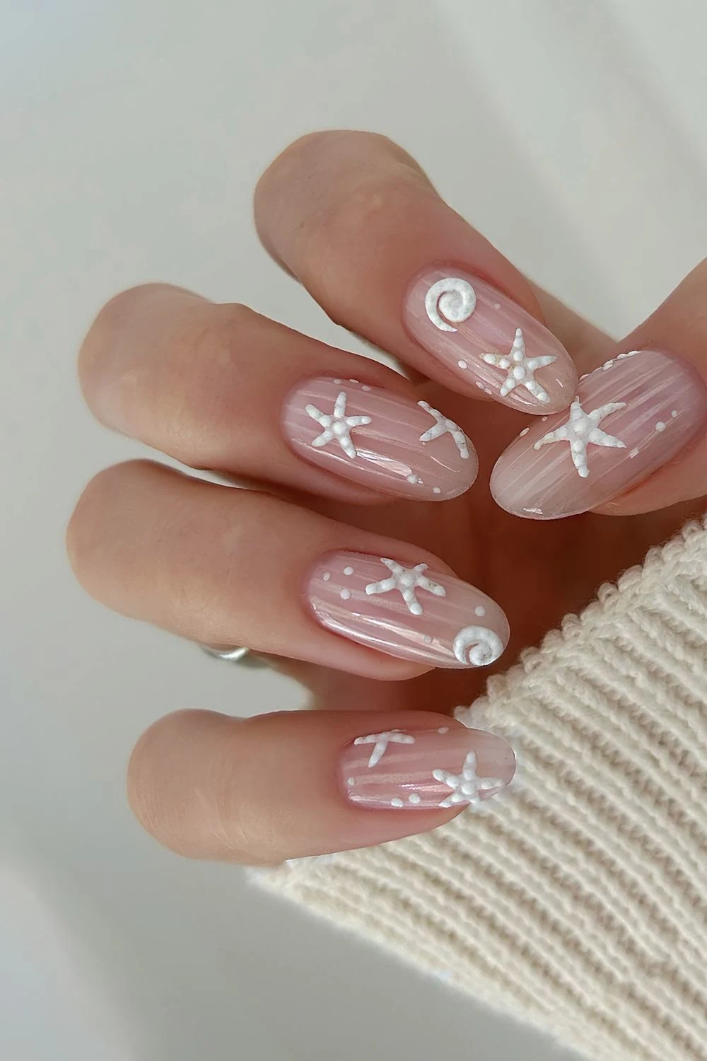 Glazed white nails with 3d white starfish nail art