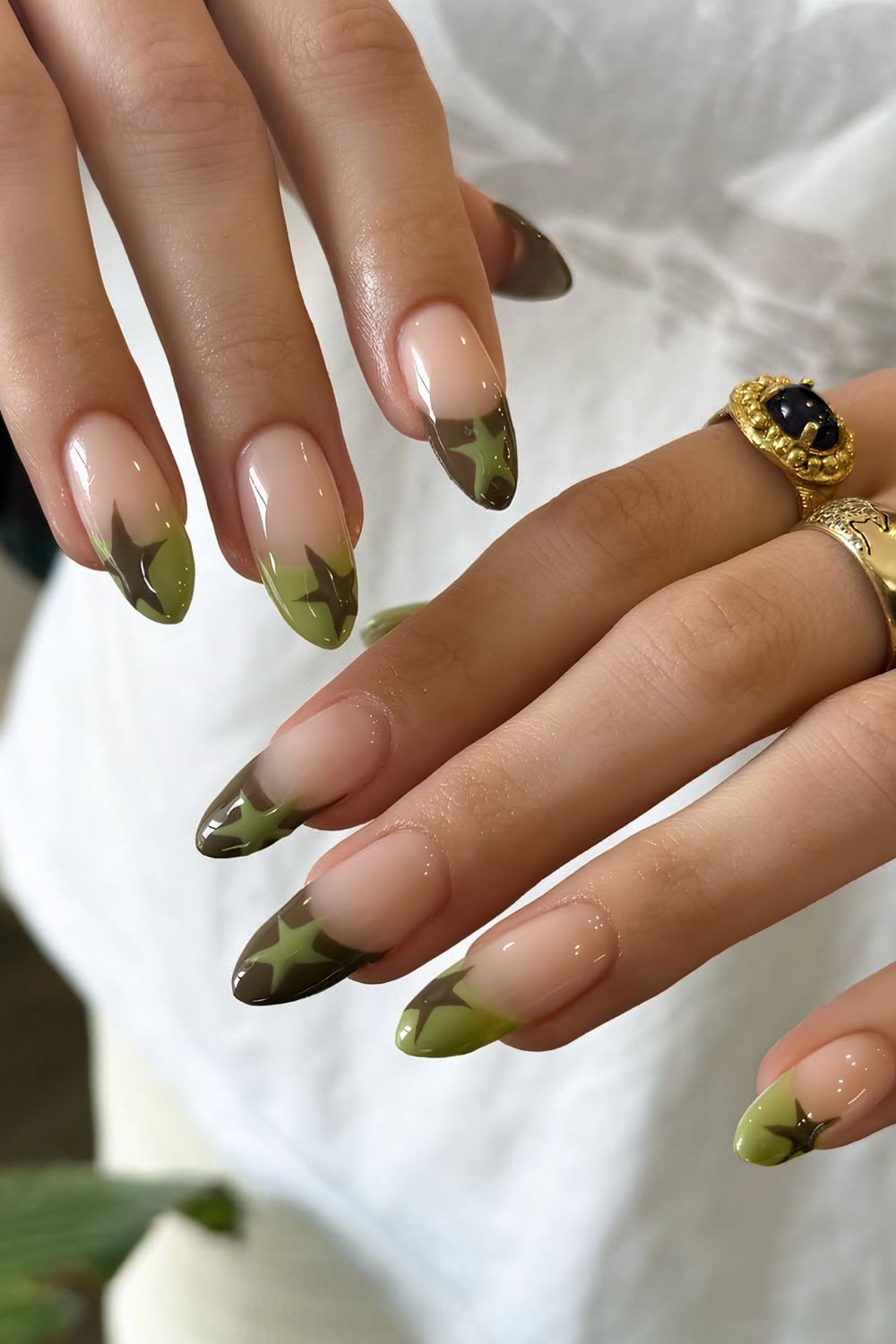 Green French mani with star accents