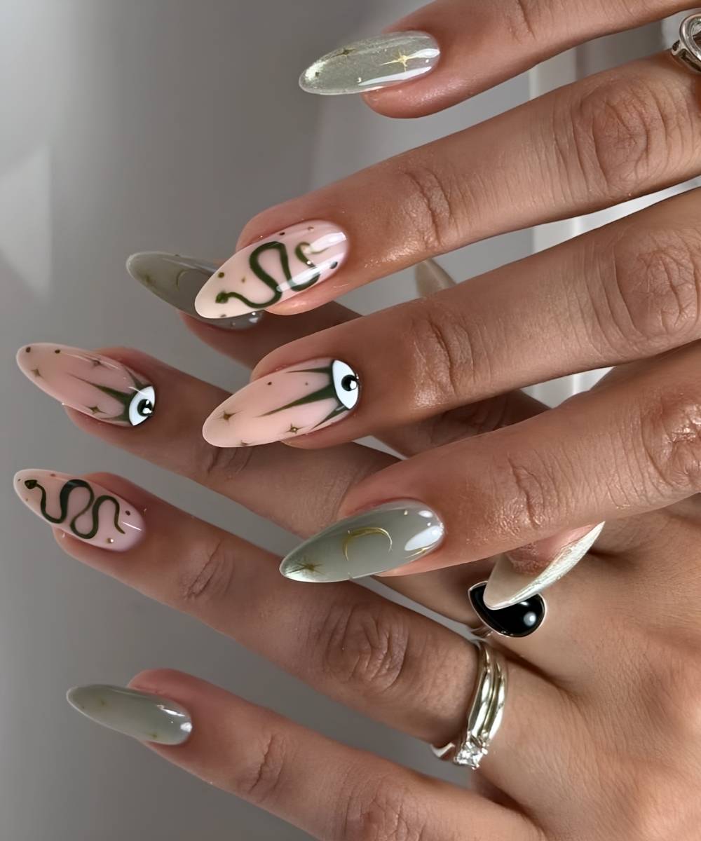 Green cat eye nails with evil eye art