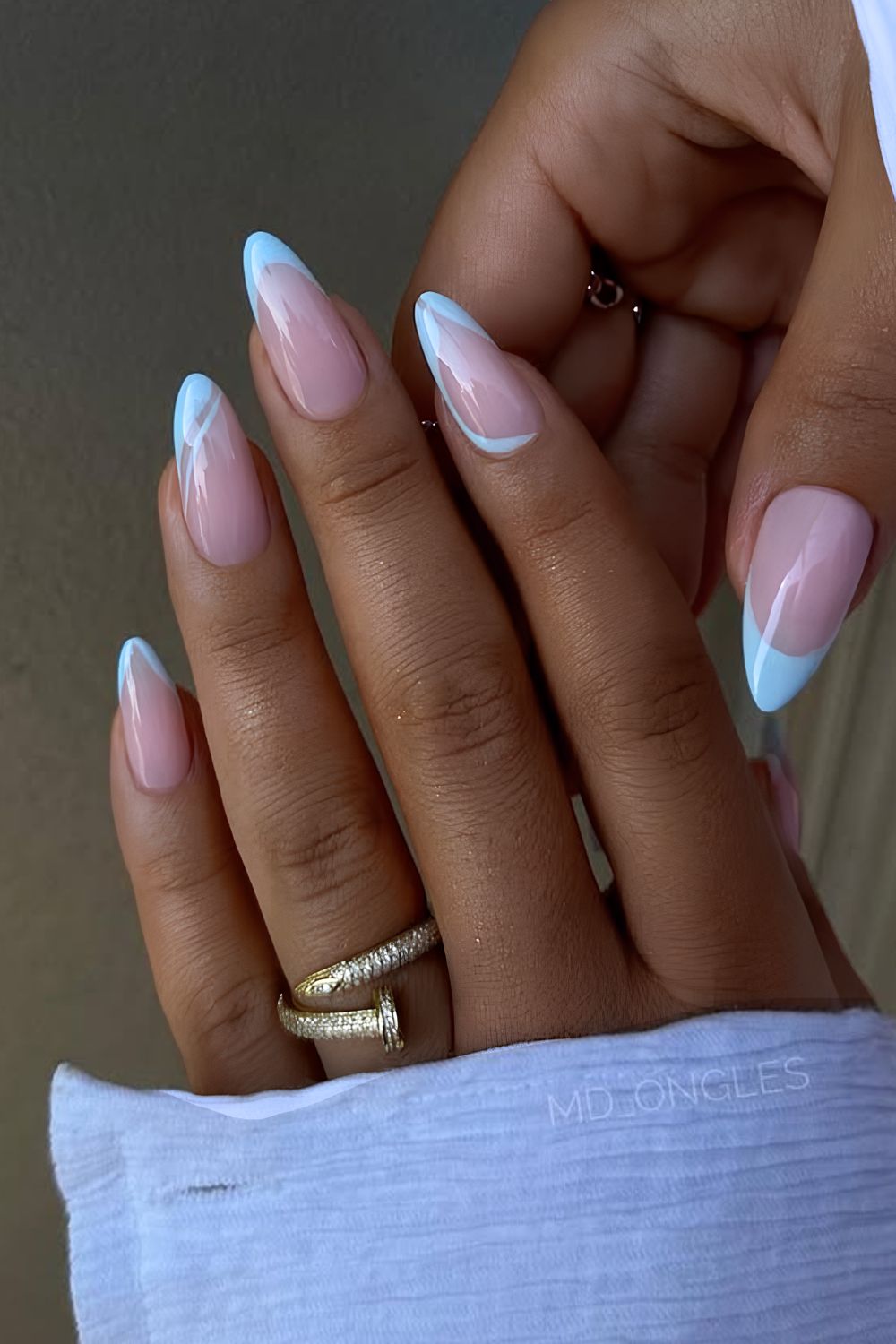 Light blue French mani with swirls