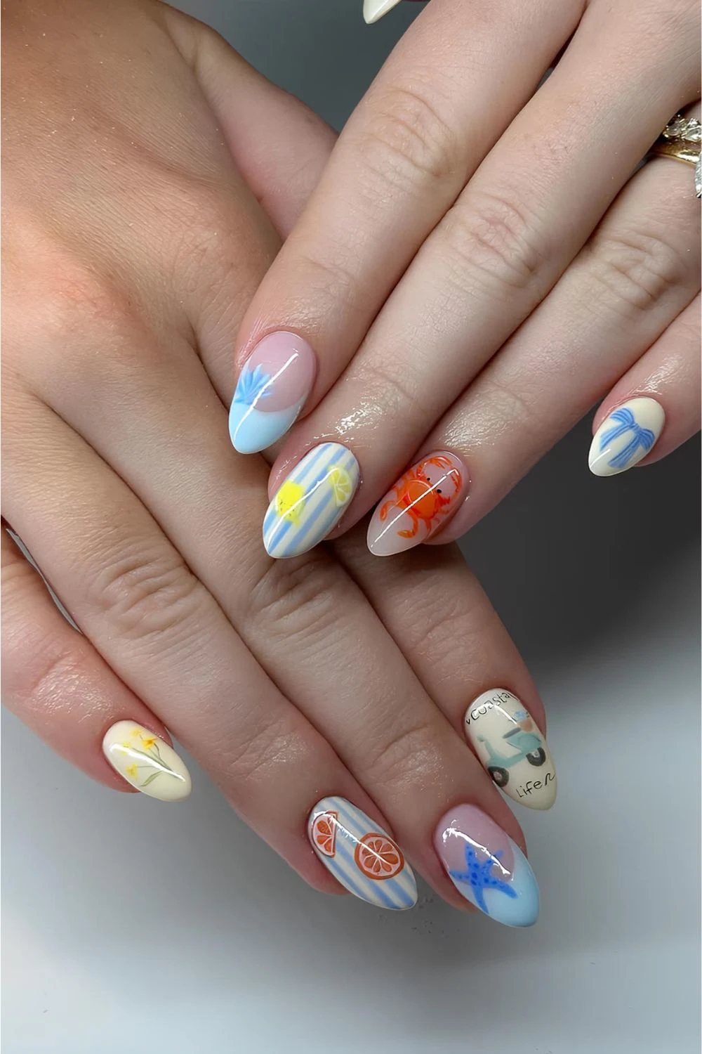 Light blue and pastel yellow striped mani with mix and match design