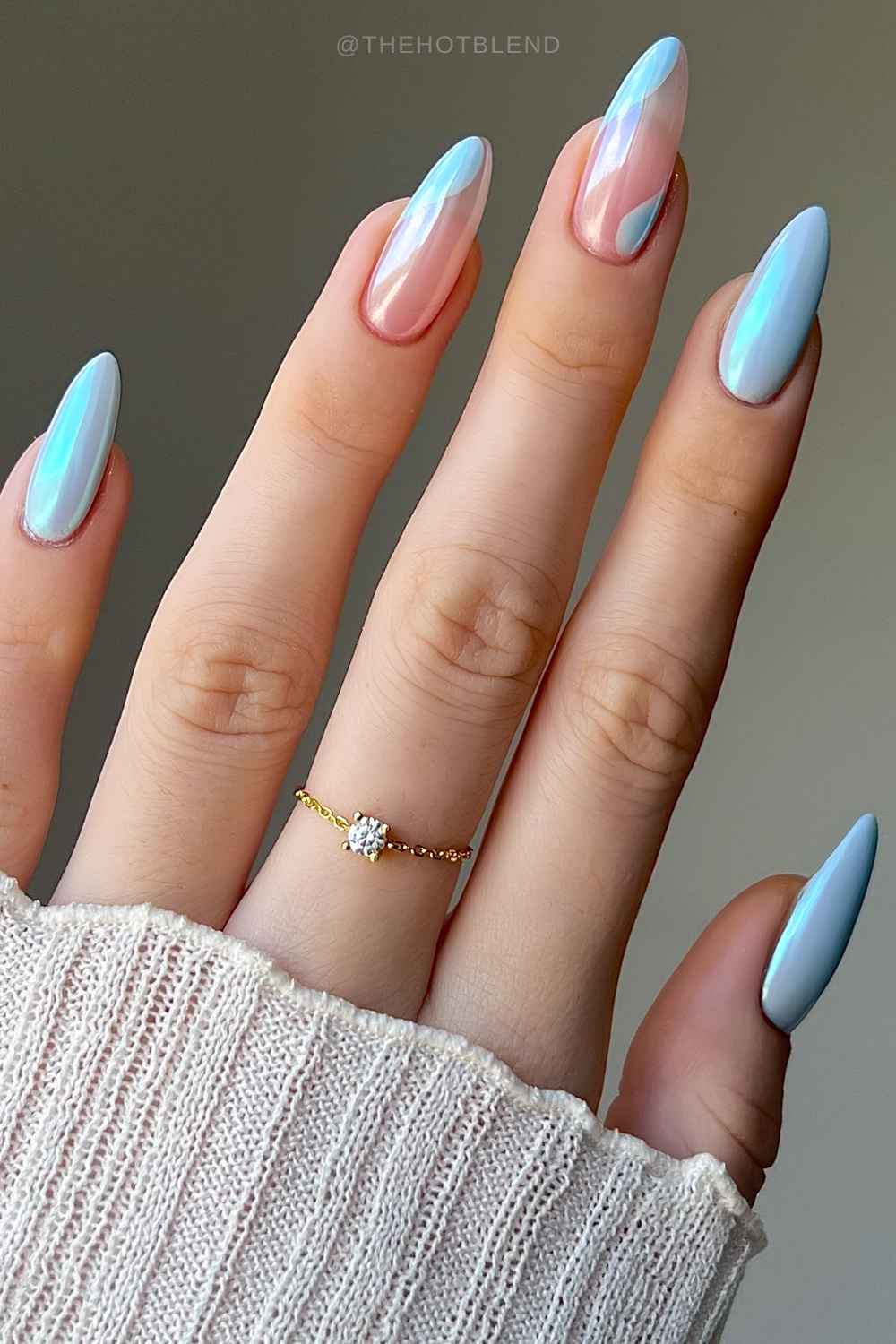 Light blue chrome nails with negative space accents