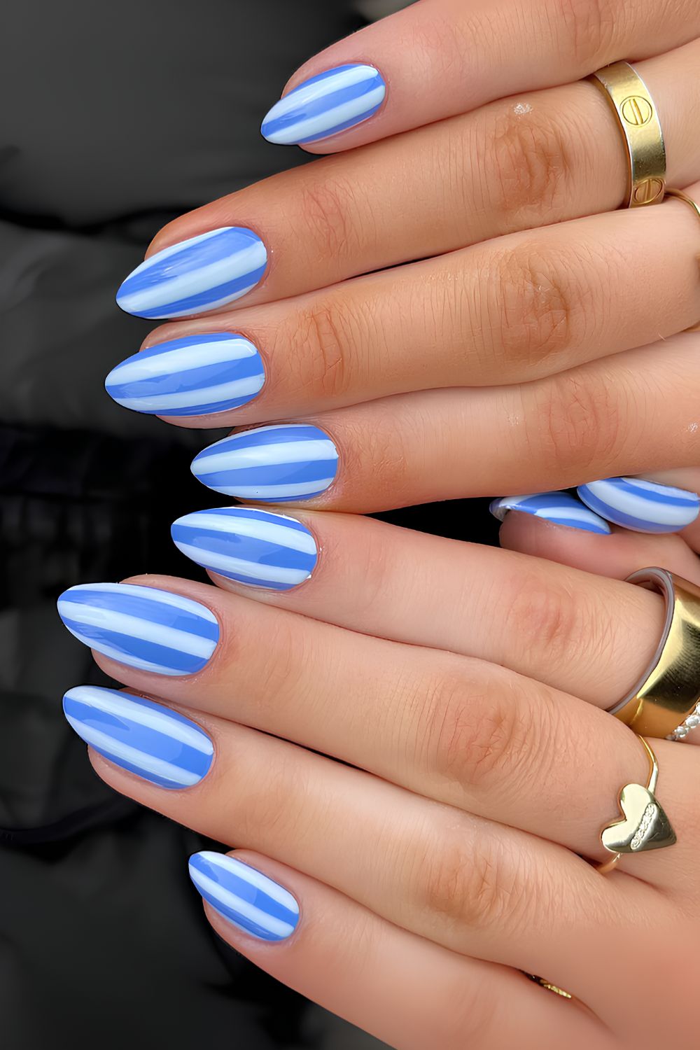 Light blue nails with mid-blue stripes
