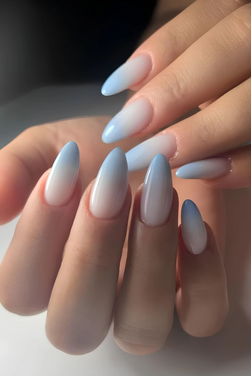 Light blue to white ombre manicure