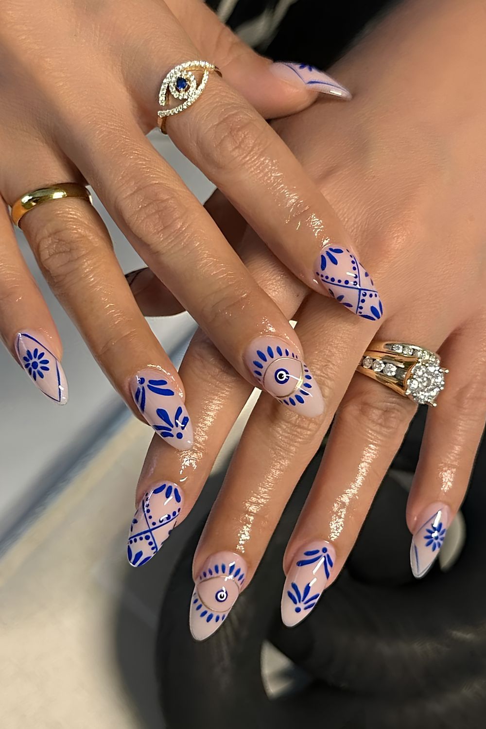 Mediteranean tile inspired nail art with mati detail