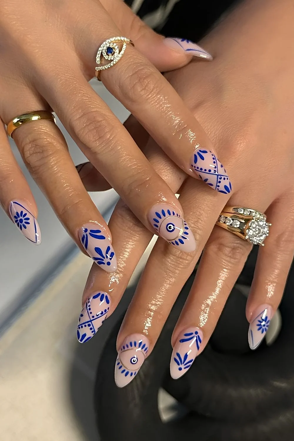 Mediteranean tile inspired nail art with mati detail