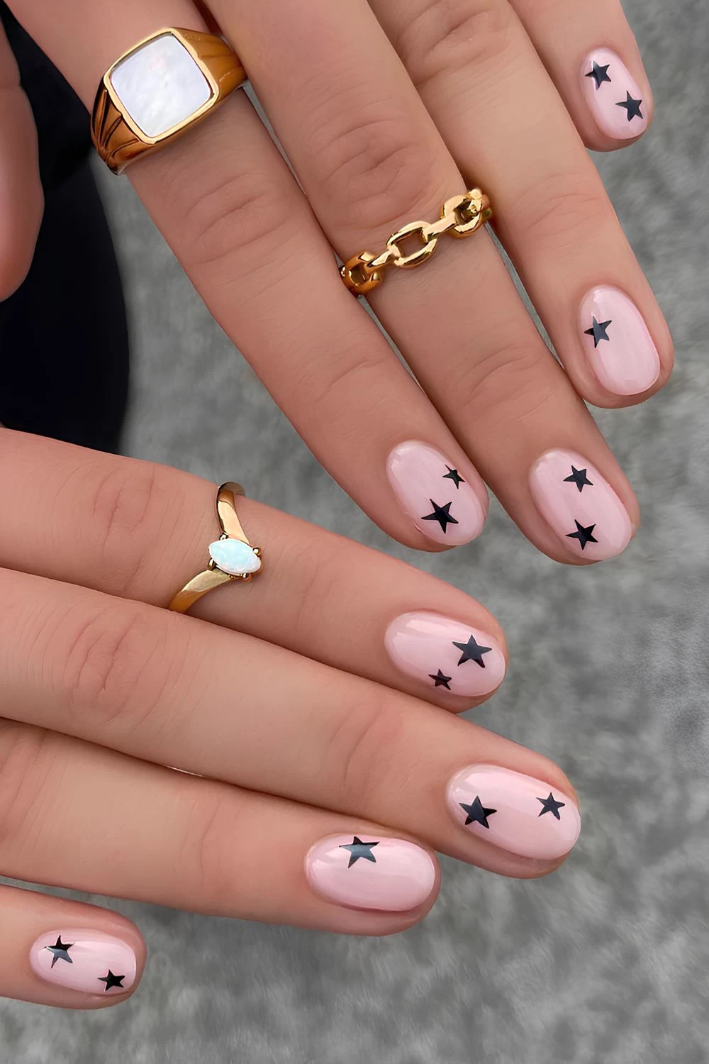 Milky nails with black star art