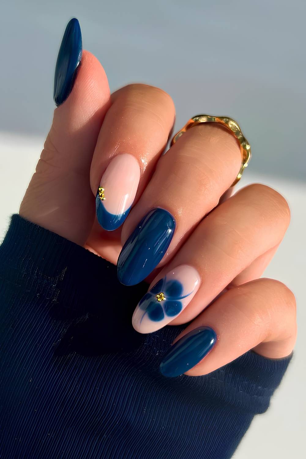 Navy blue manicure with blooming gel flower art