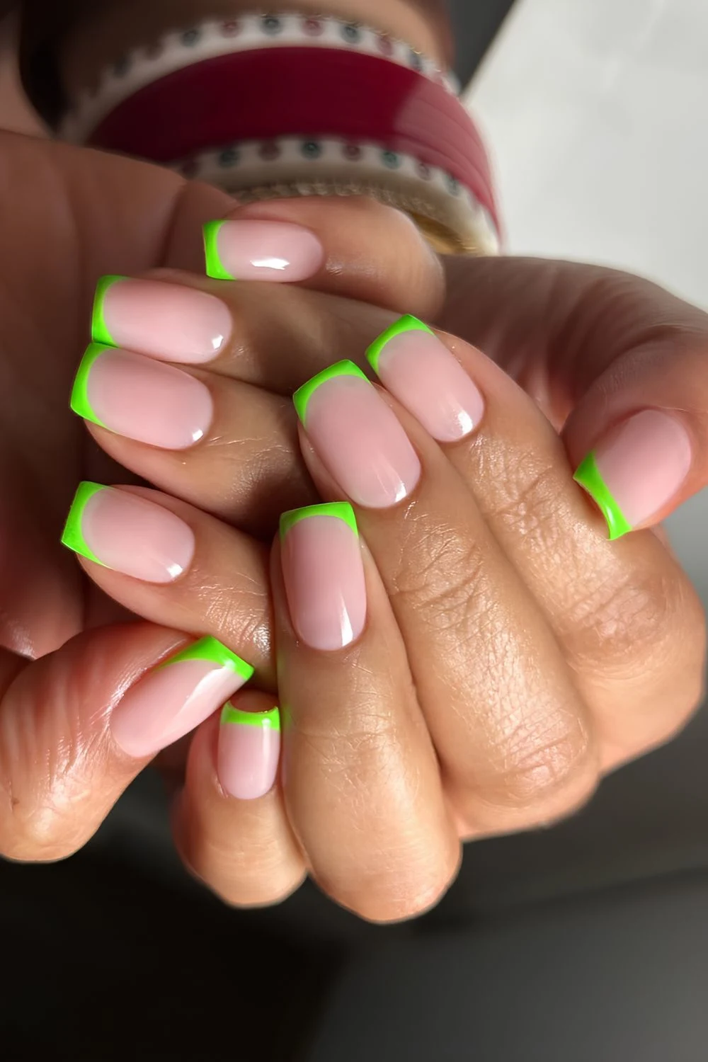 Neon green French tip nails