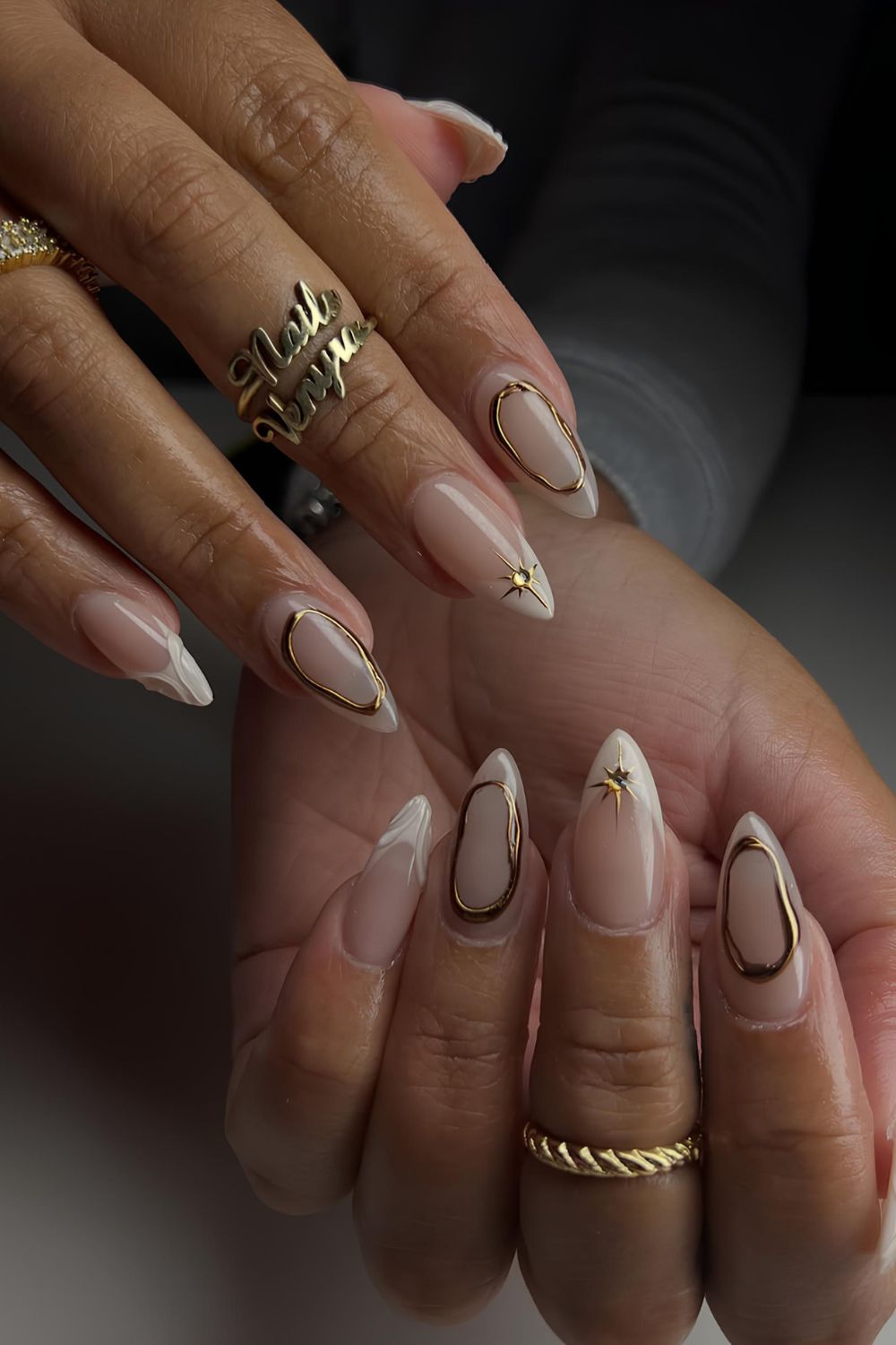Neutral nails with gold chrome accents